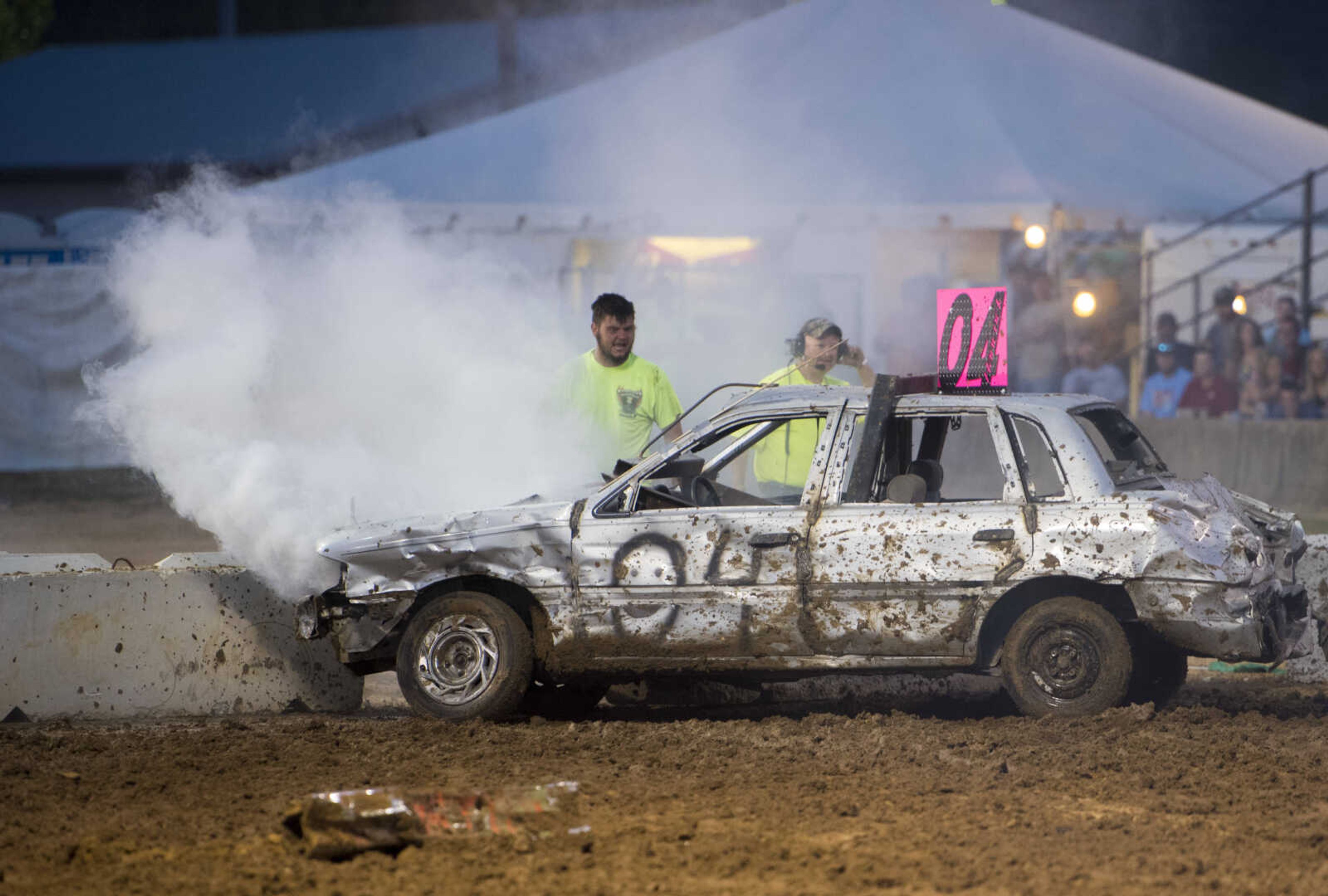 Smoke pours from the hood of a car during the Auto Tire & Parts Dual Demo Derby September 9, 2017, at the SEMO District Fair in Cape Girardeau.