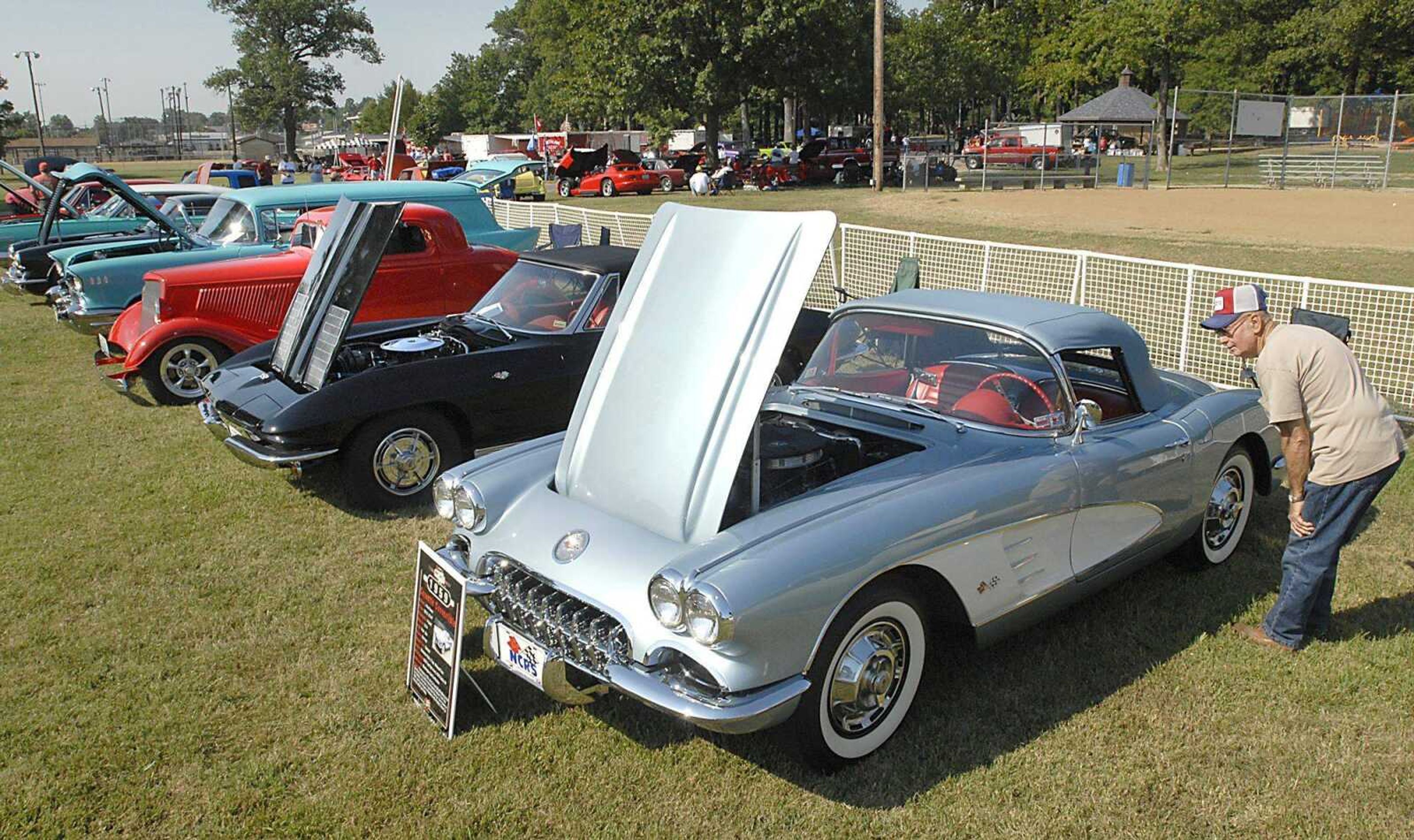 FRED LYNCH ~ flynch@semissourian.com
Joe Crader of Delta, Mo., looked over a 1959 Corvette convertible, owned by Brad Kasten, at the Cars for Kids car show Saturday at Arena Park.