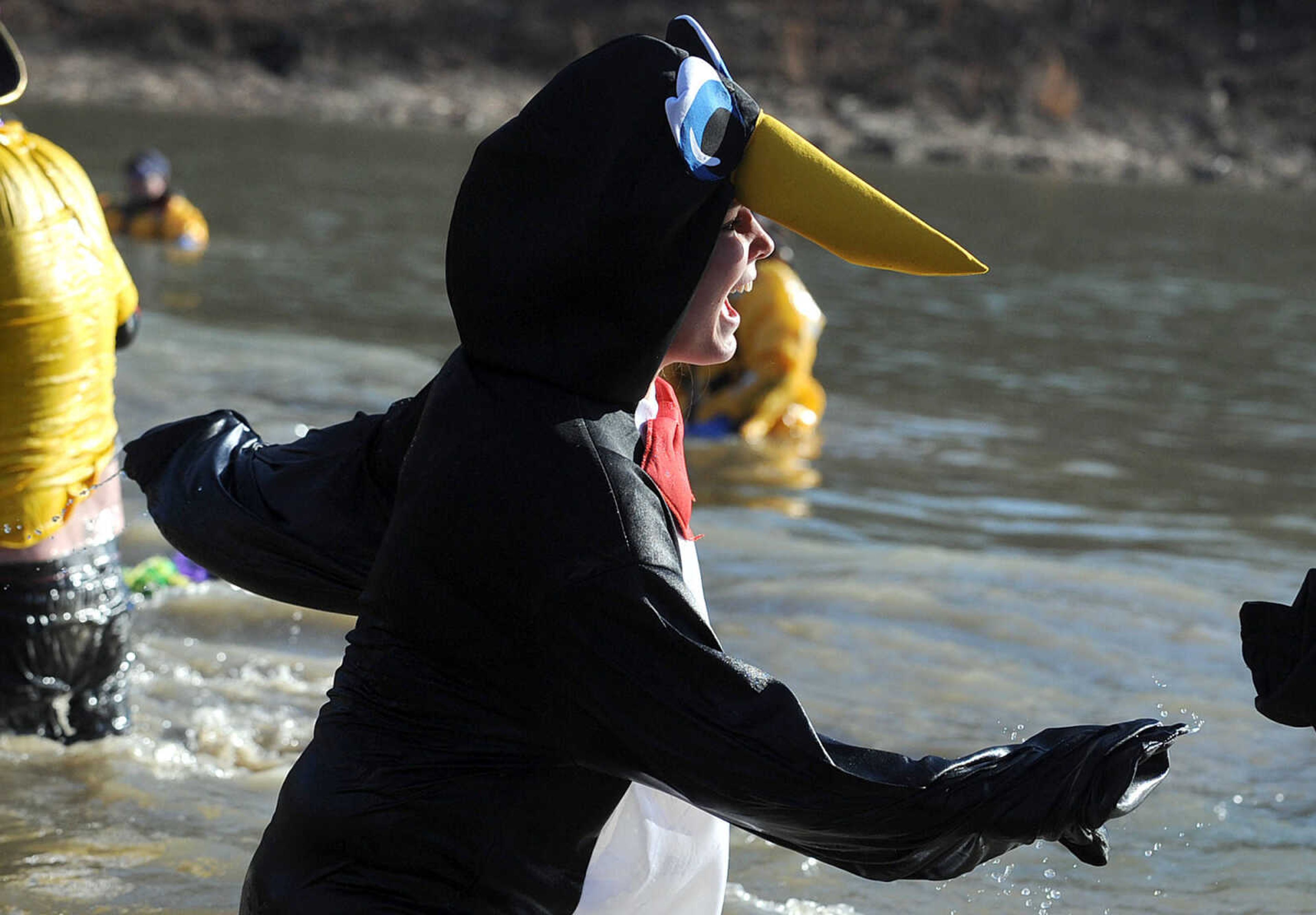 LAURA SIMON ~ lsimon@semissourian.com
People plunge into the cold waters of Lake Boutin Saturday afternoon, Feb. 2, 2013 during the Polar Plunge at Trail of Tears State Park. Thirty-six teams totaling 291 people took the annual plunge that benefits Special Olympics Missouri.