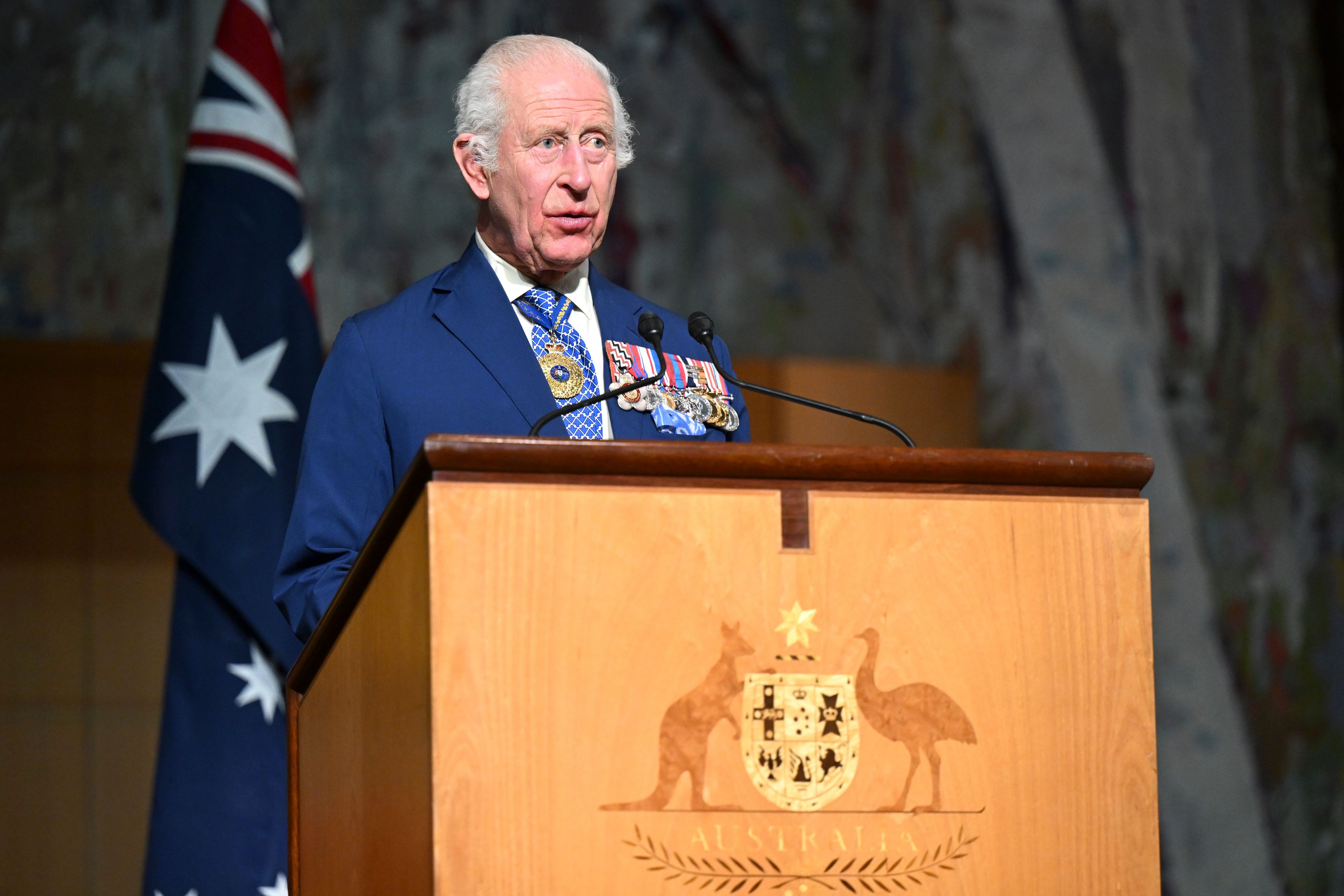 Britain's King Charles III delivers a speech while attending a Parliamentary reception hosted by Australian Prime Minister Anthony Albanese and partner Jodie Jaydon at Parliament House in Canberra, Australia, Monday, Oct. 21, 2024. (Lukas Coch/Pool Photo via AP)