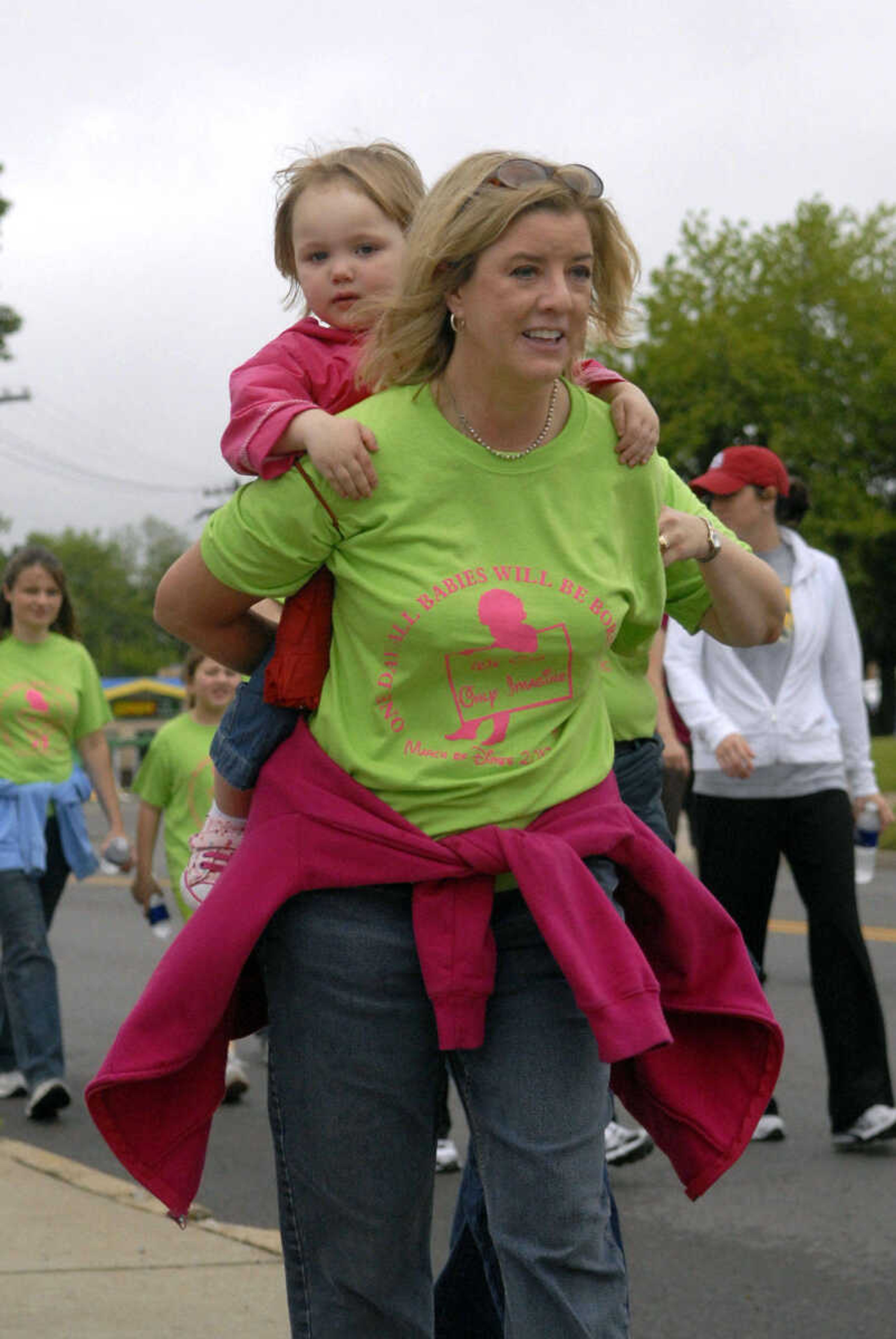 KRISTIN EBERTS ~ keberts@semissourian.com

Alicia Adams carries Emma Manken during the March of Dimes March for Babies in Cape Girardeau, Mo., on Saturday, May 1, 2010.