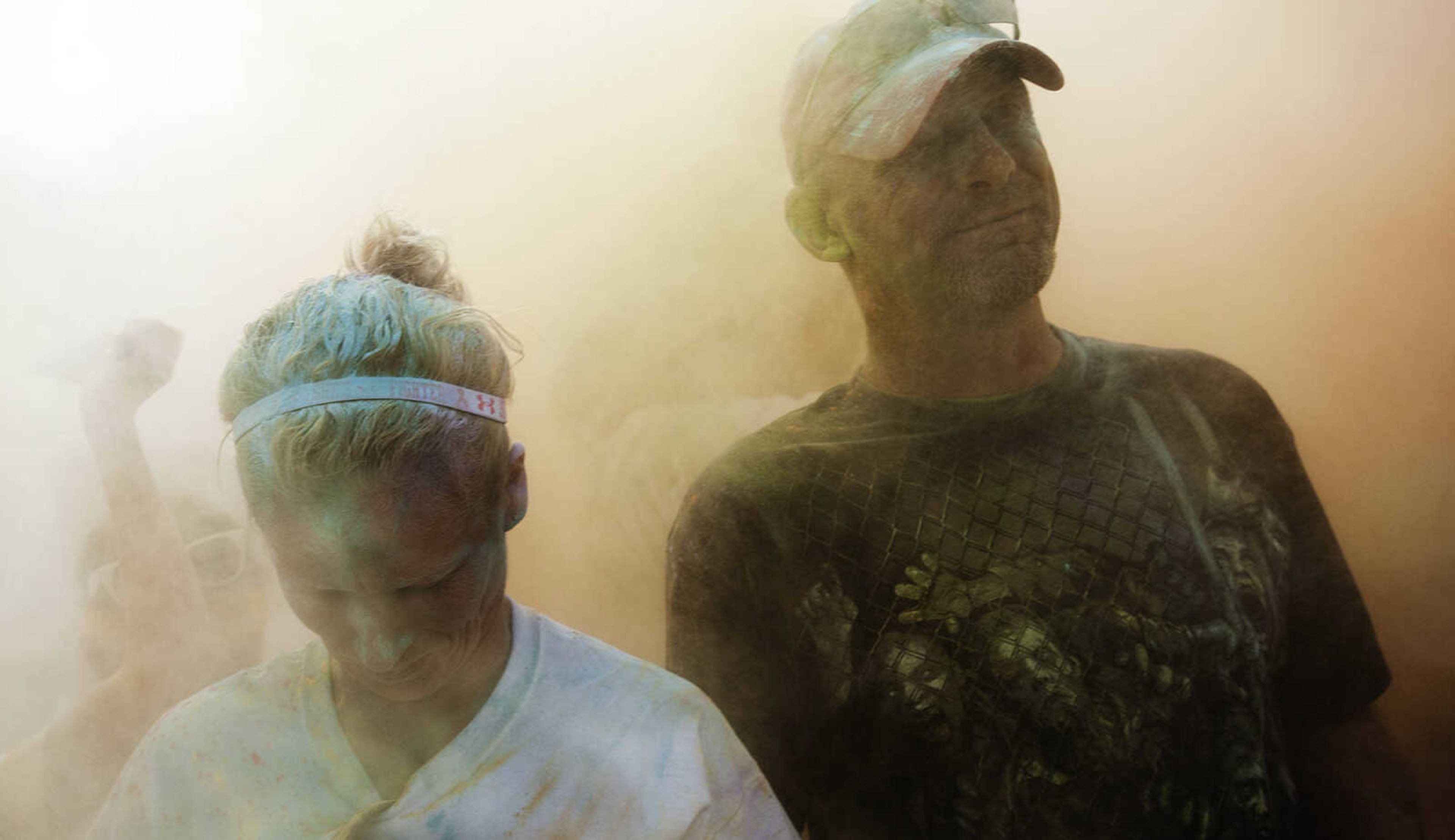 ADAM VOGLER ~ avogler@semissourian.com
Participants in the Color Me Cape 5k throw colored powder in the air in the street in front of the Bell Air Grill during the color bomb after the run Saturday, April 12, in Cape Girardeau.