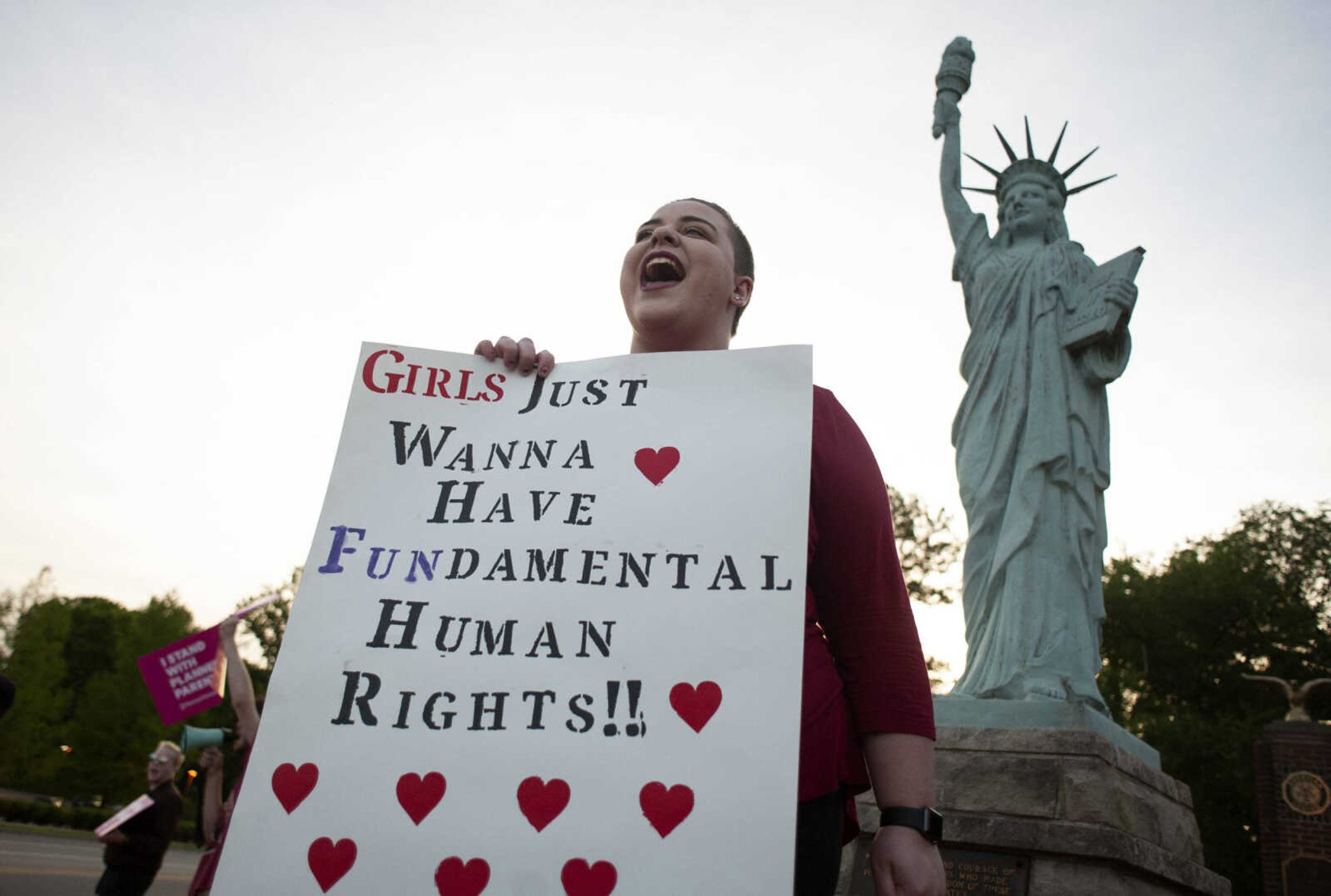 Courtney Pratt of Cape Girardeau protests with other supporters of abortion rights Monday at Capaha Park´s Freedom Corner in Cape Girardeau. “I am here because women have been suffering for so long and they, we need our voices heard,” Pratt said. Demonstrator Aaron Lerma, originally of Malden, Missouri, and now of Cape Girardeau, who identified himself as a grassroots organizer with Planned Parenthood Action Fund, estimated 80 to 85 protesters took part in the event.