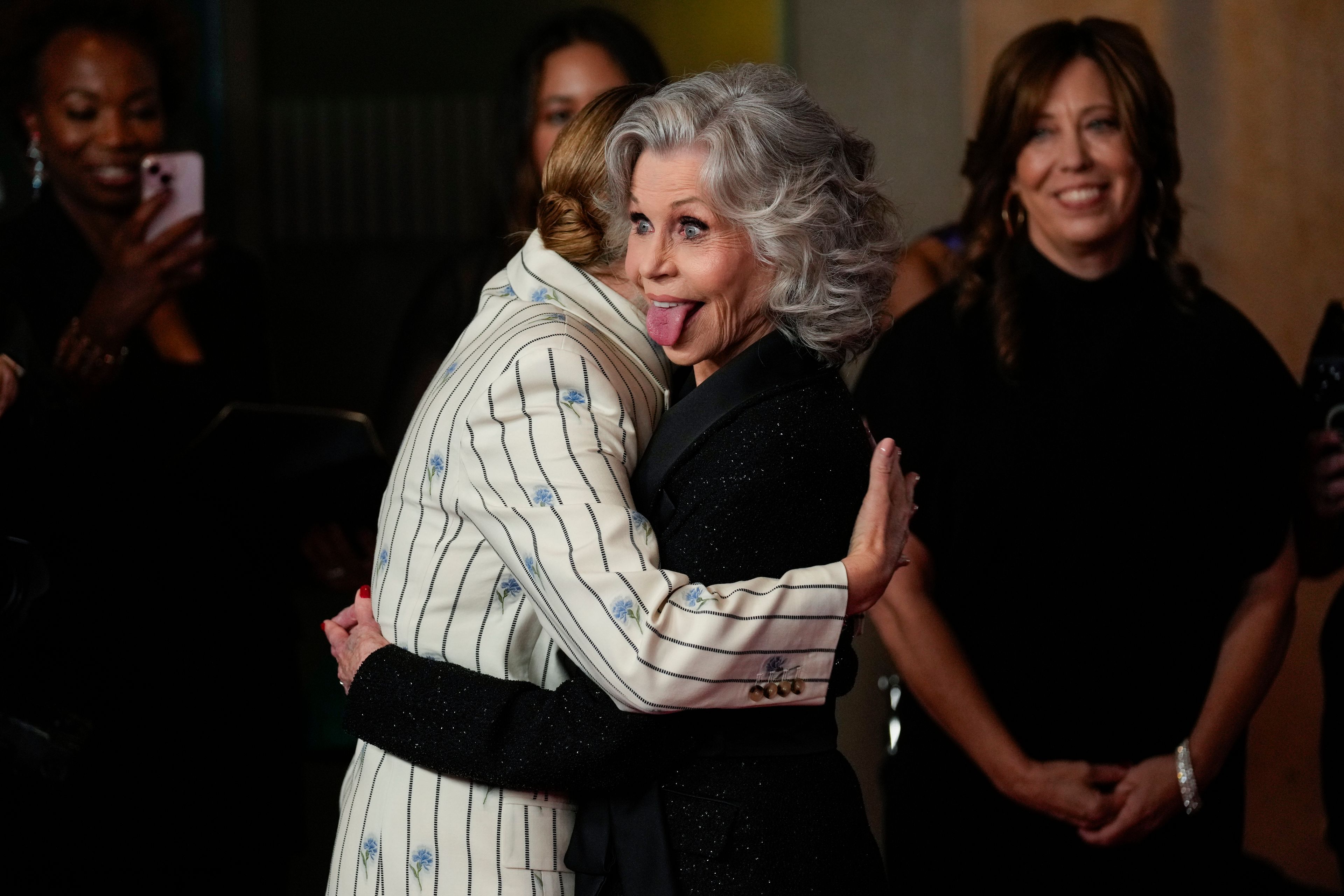 Kate Winslet, left, and Jane Fonda embrace during the Women in Film Honors on Thursday, Oct. 23, 2024, at The Beverly Hilton in Beverly Hills, Calif. (AP Photo/Chris Pizzello)