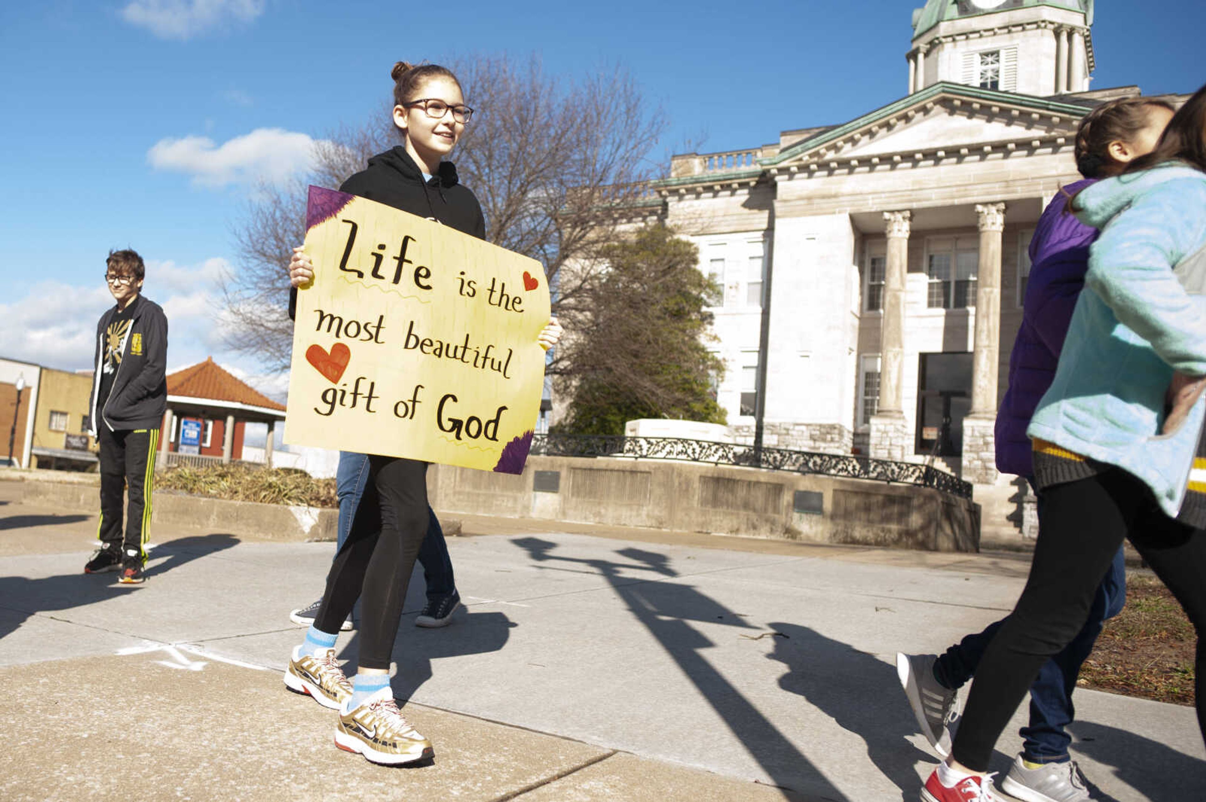 Lolah Wunderlich, 11, of Cape Girardeau, takes part in a March for Life on Saturday, Jan. 18, 2020, in Jackson.