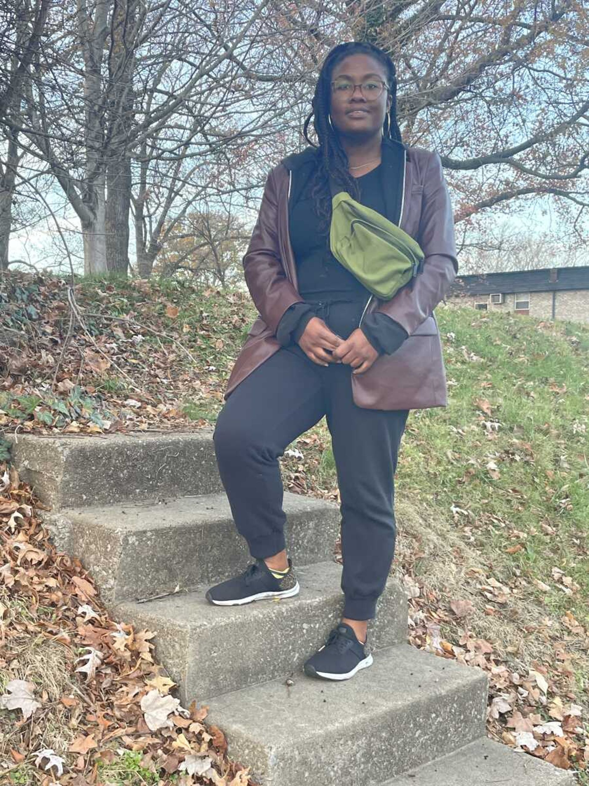 Michecia Jones stands on the Jones homestead steps in 2023. She is a third-generation descendant of Enoch and Mamie Jones.