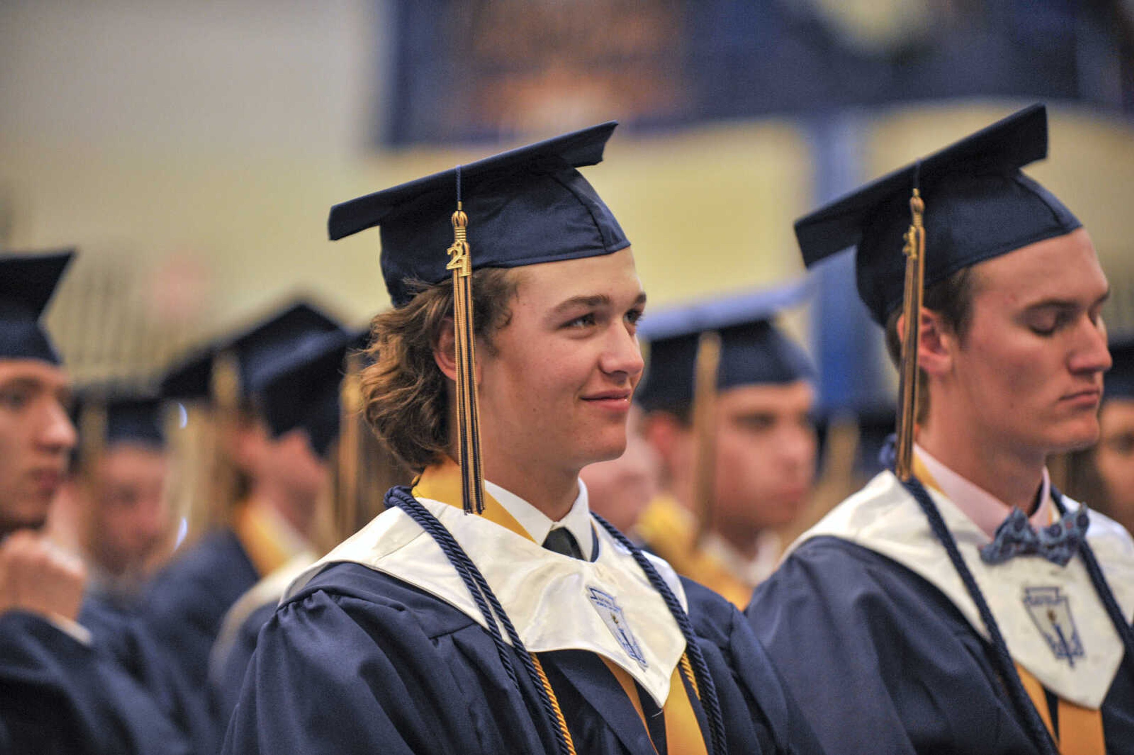 A Saxony Lutheran High School senior listens to the commencement address by teacher Becky Wichern during commencement at Saxony Lutheran High School on Sunday, May 16, 2021.