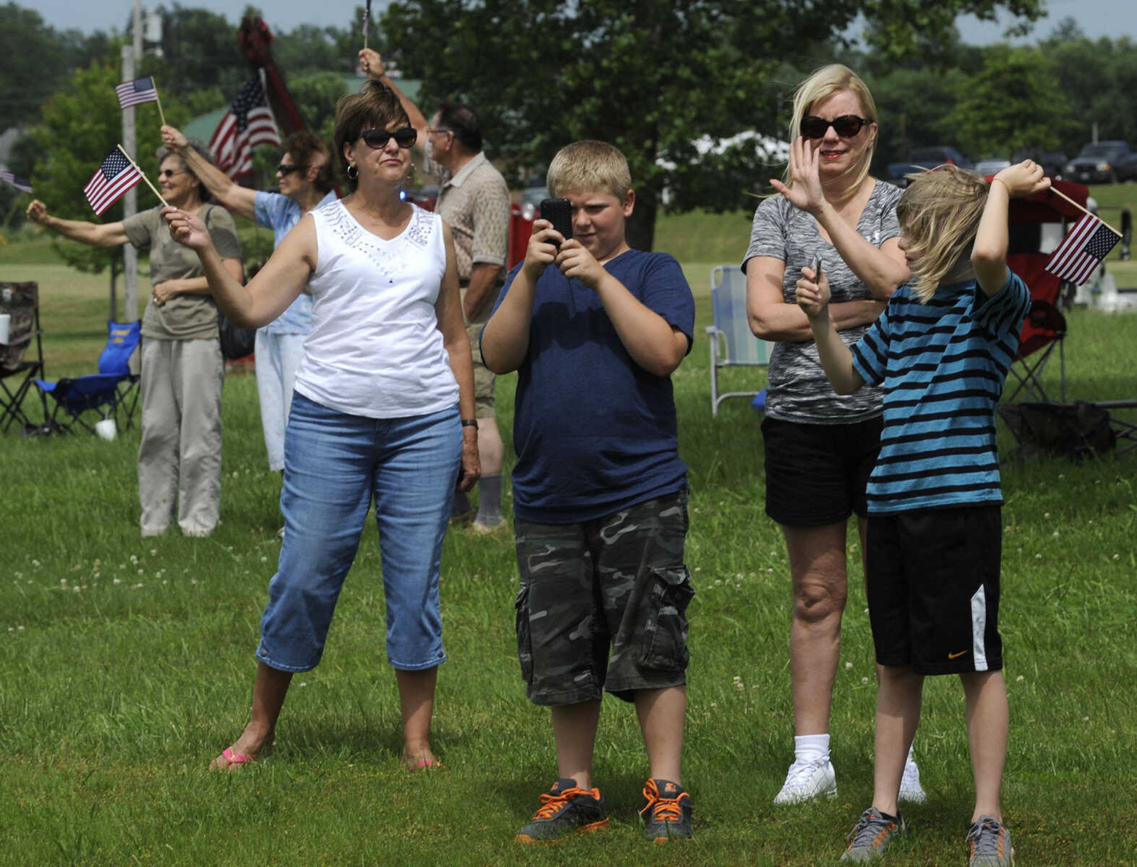 People welcome The Wall That Heals as it arrives Tuesday, June 17, 2014 in Perryville, Mo.