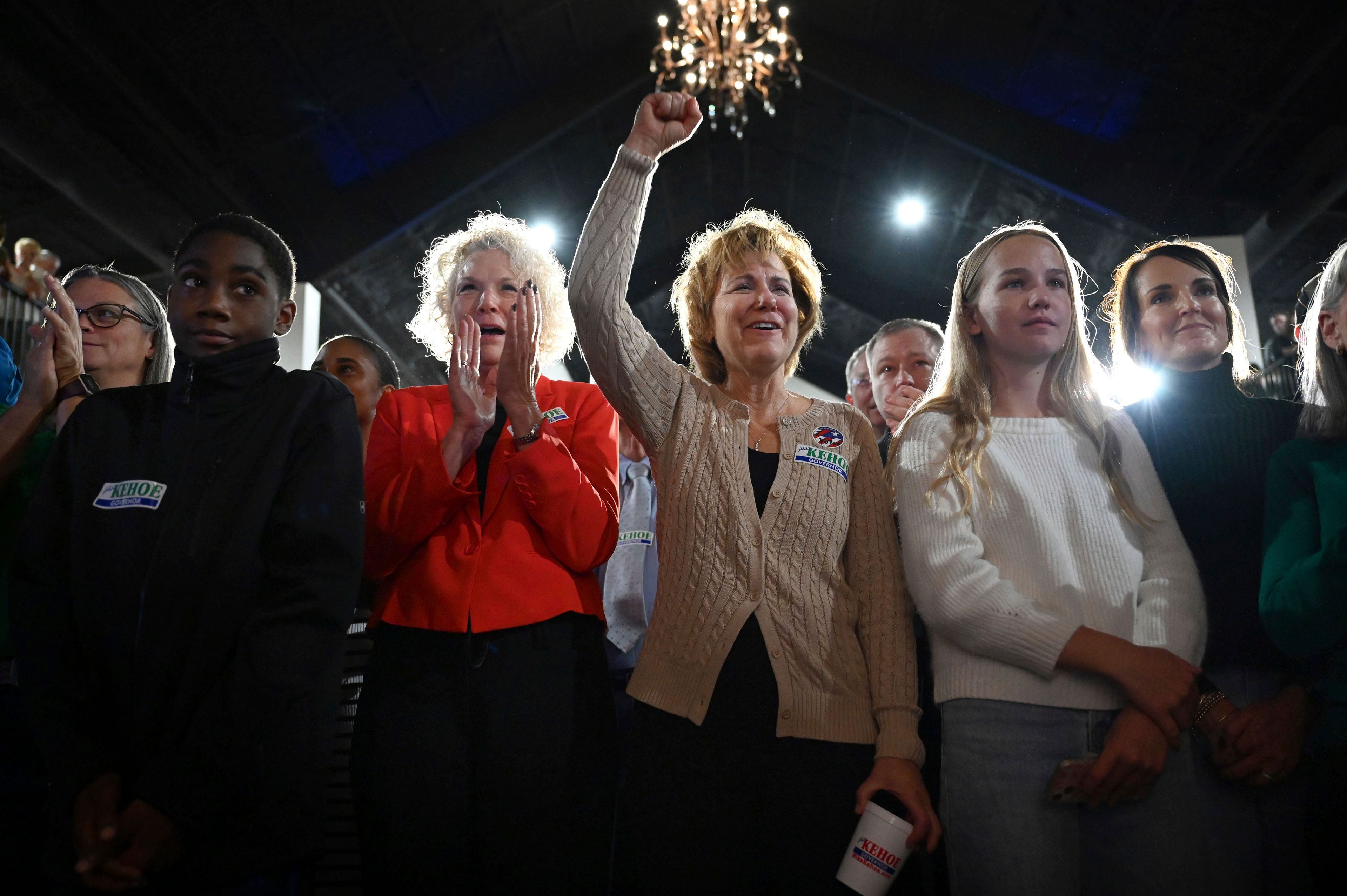 Vicki Mennemeyer, from second left, Ginny Mennemeyer, Mia Lock, 13, and Katie Lock cheer for Republican Governor-elect Mike Kehoe on election night Tuesday, Nov. 5, 2024, at the Capital Bluffs Event Center in Jefferson City, Mo. (Bailey Stover/Missourian via AP)