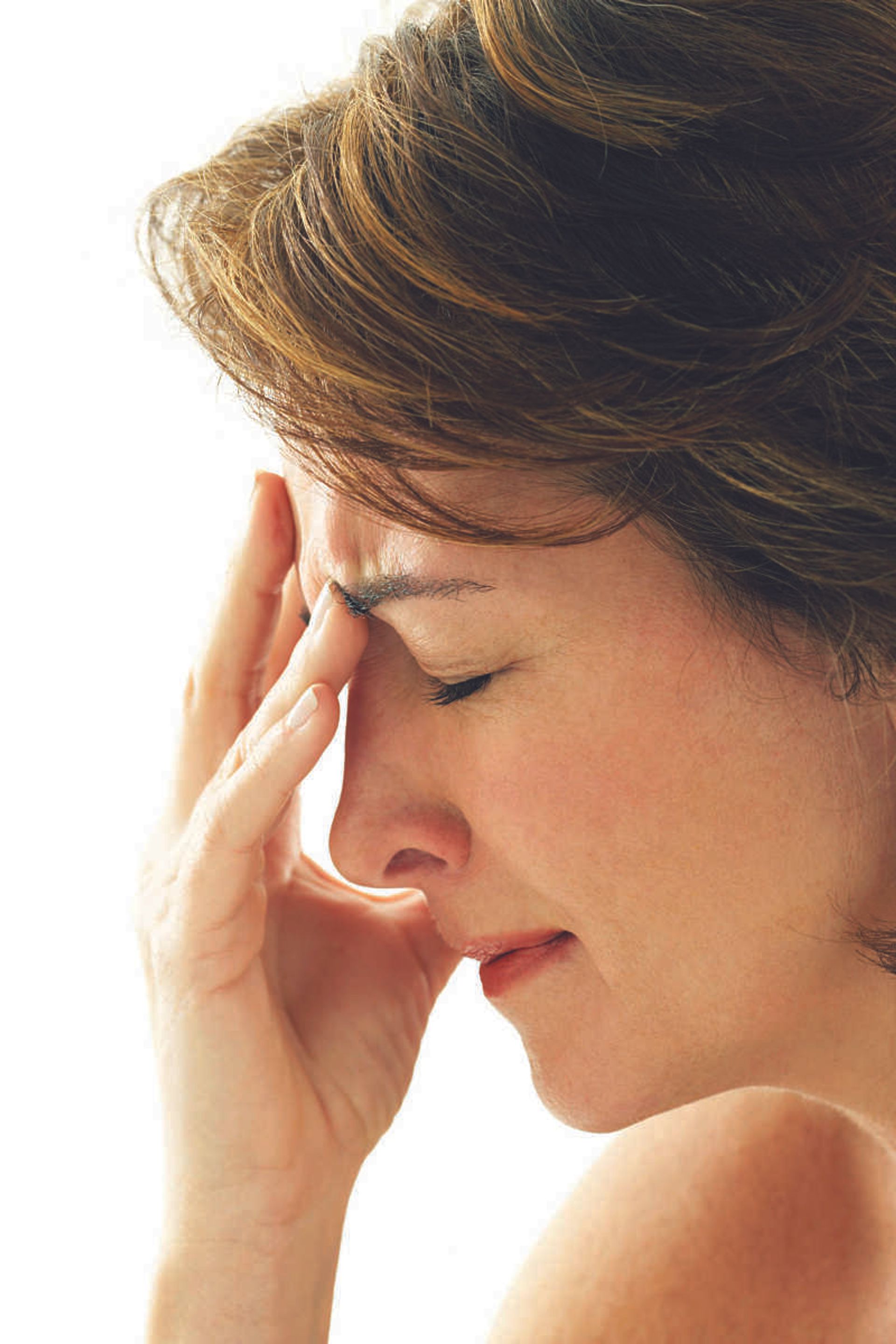 Mature woman crying, side view, close-up