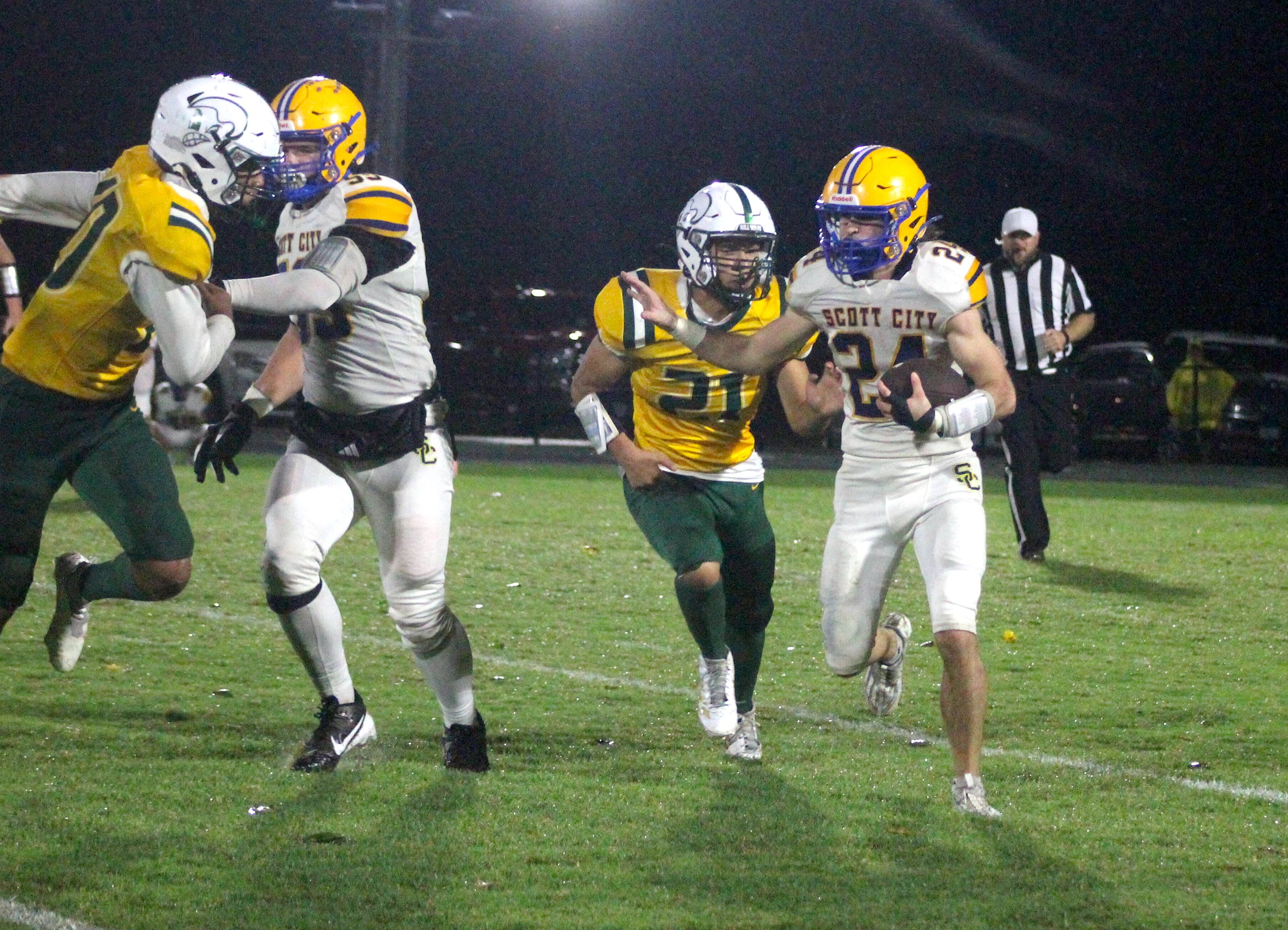 Scott City's Rustyn Underwood, right, carries the ball against Malden on Friday, Sept. 26, in Malden.
