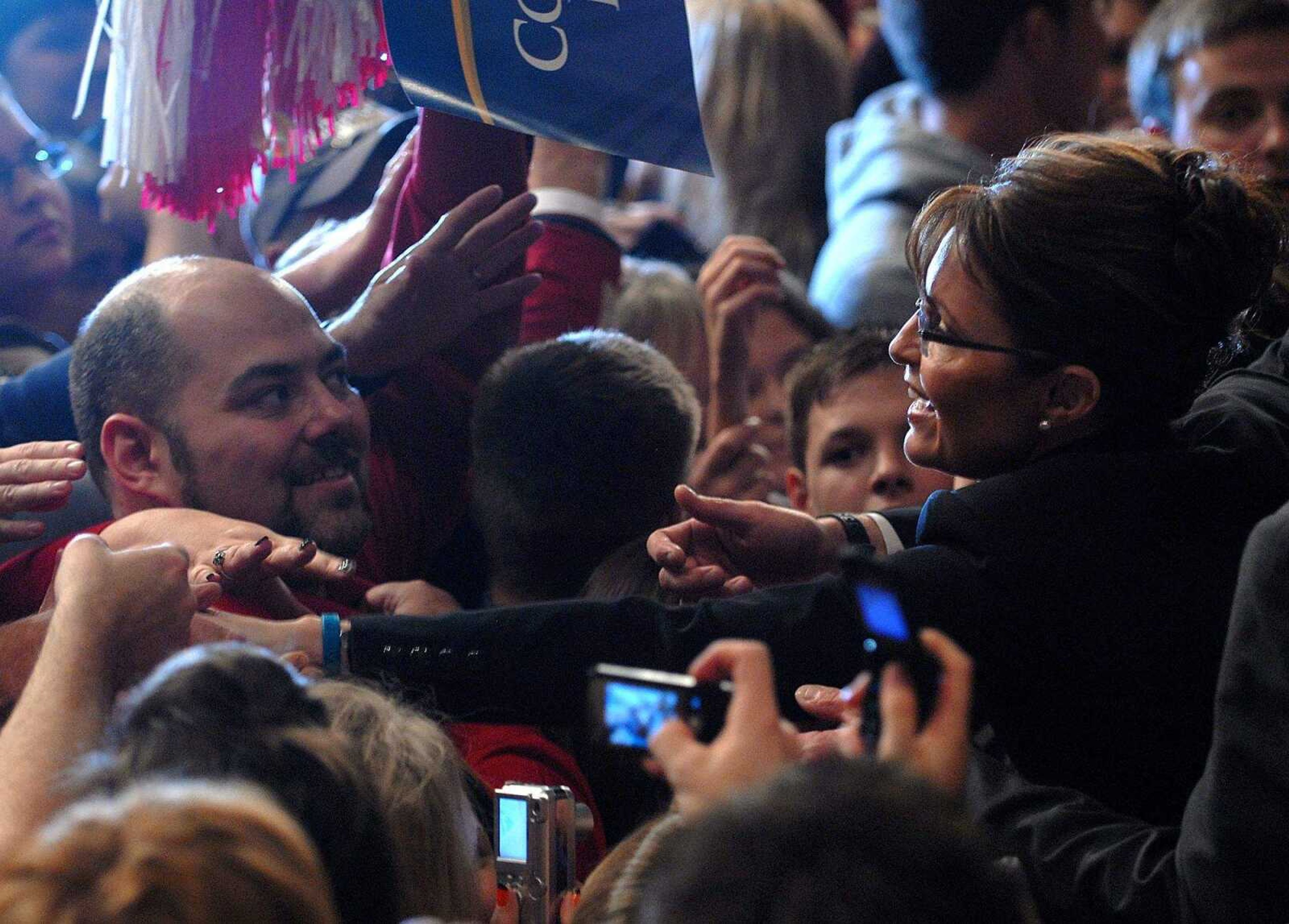 AARON EISENHAUER ~ aeisenhauer@semissourian.com
Sarah Palin reaches into the crowd to shake hands with supporters.