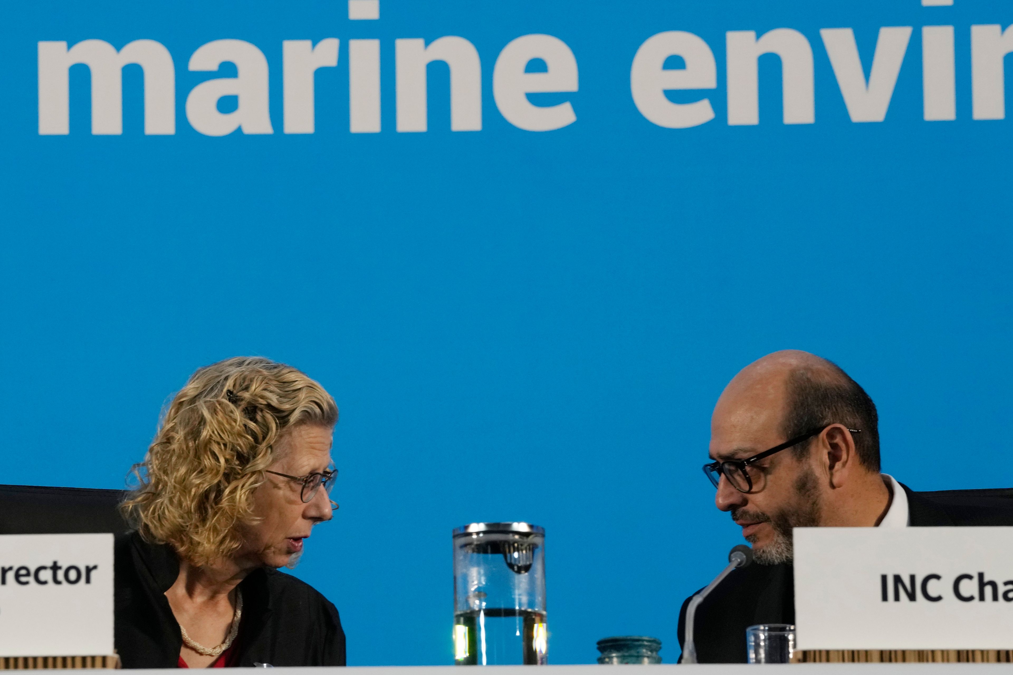 Chair of the International Negotiating Committee, Luis Vayas Valdivieso, right, speaks with Inger Andersen, Executive Director of UNEP, before the start of a plenary of the fifth session of the Intergovernmental Negotiating Committee on Plastic Pollution in Busan, South Korea, Sunday, Dec. 1, 2024. (AP Photo/Ahn Young-joon)