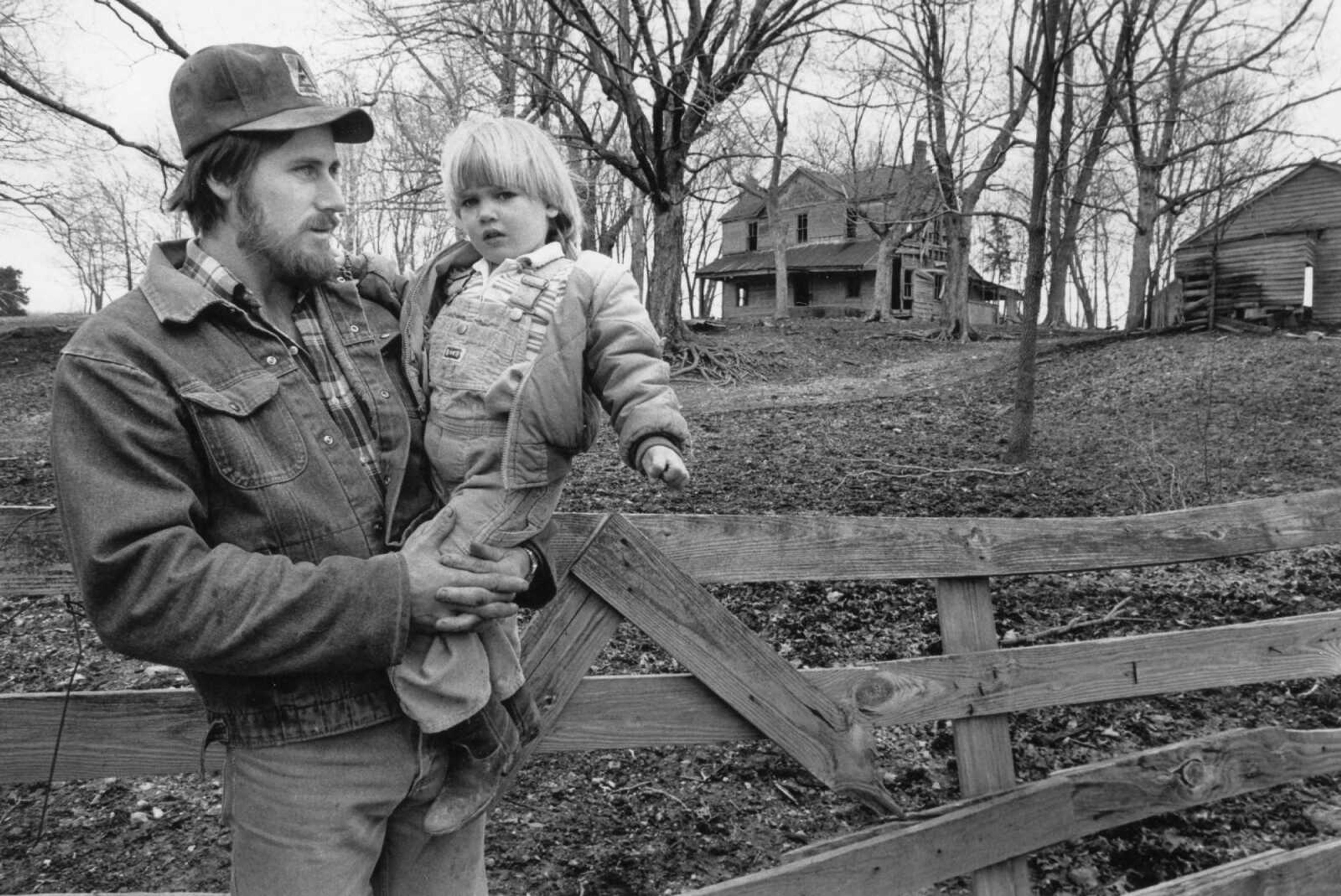 Published Feb. 28,1990
Rodney Roberts and 3-year-old Whitney were shown at the Wills farm north of Millersville. The 200-acre farm, leased by the Roberts, was homesteaded by David H. Wills in 1843. It was recently honored as a Century Farm. One of the requirements of a Century Farm was that it must be owned by the same family for more than 100 years. (Southeast Missourian archive photo)