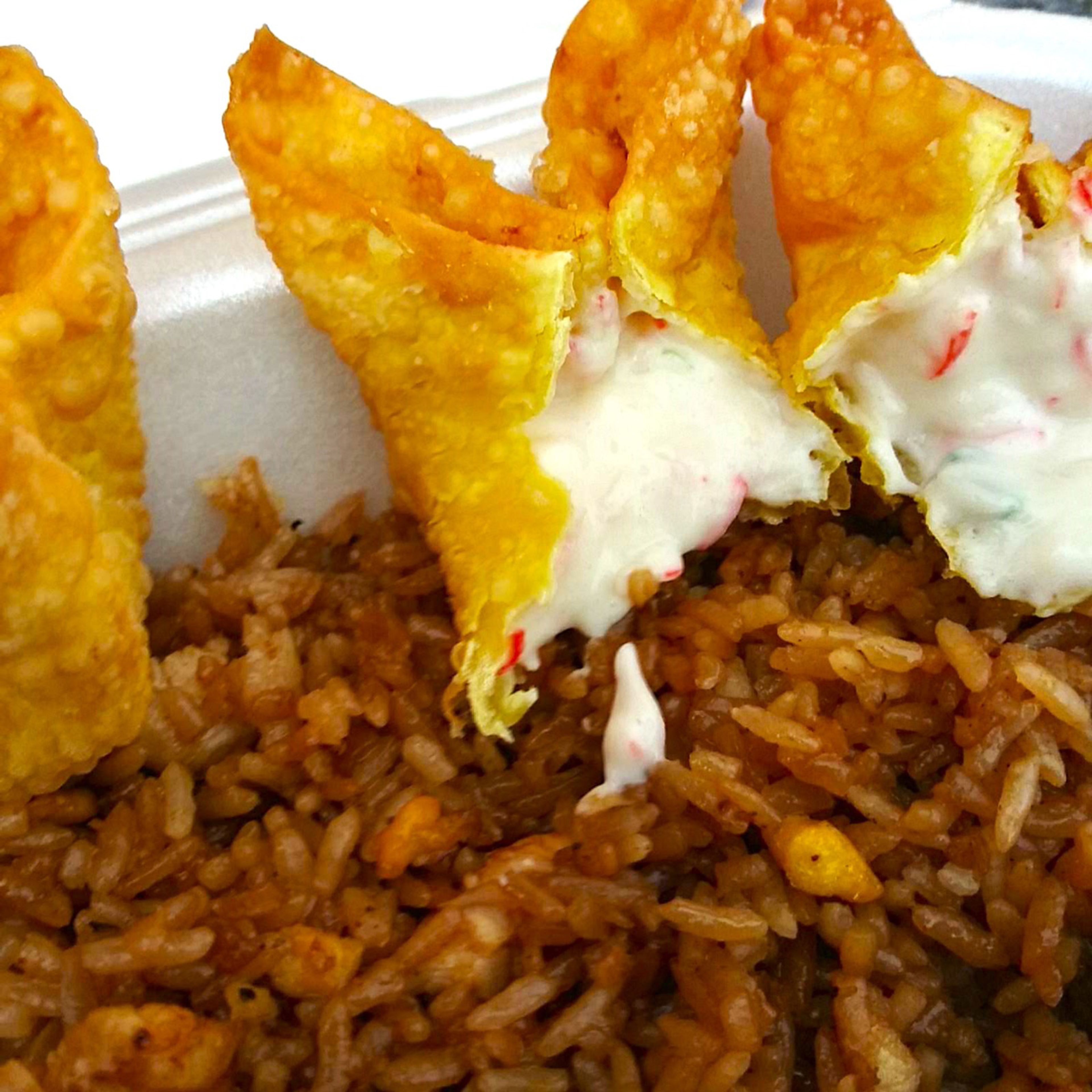 Don't sleep on the Crab Rangoons and Chicken Fried Rice Mixed. That rice will make you smile.