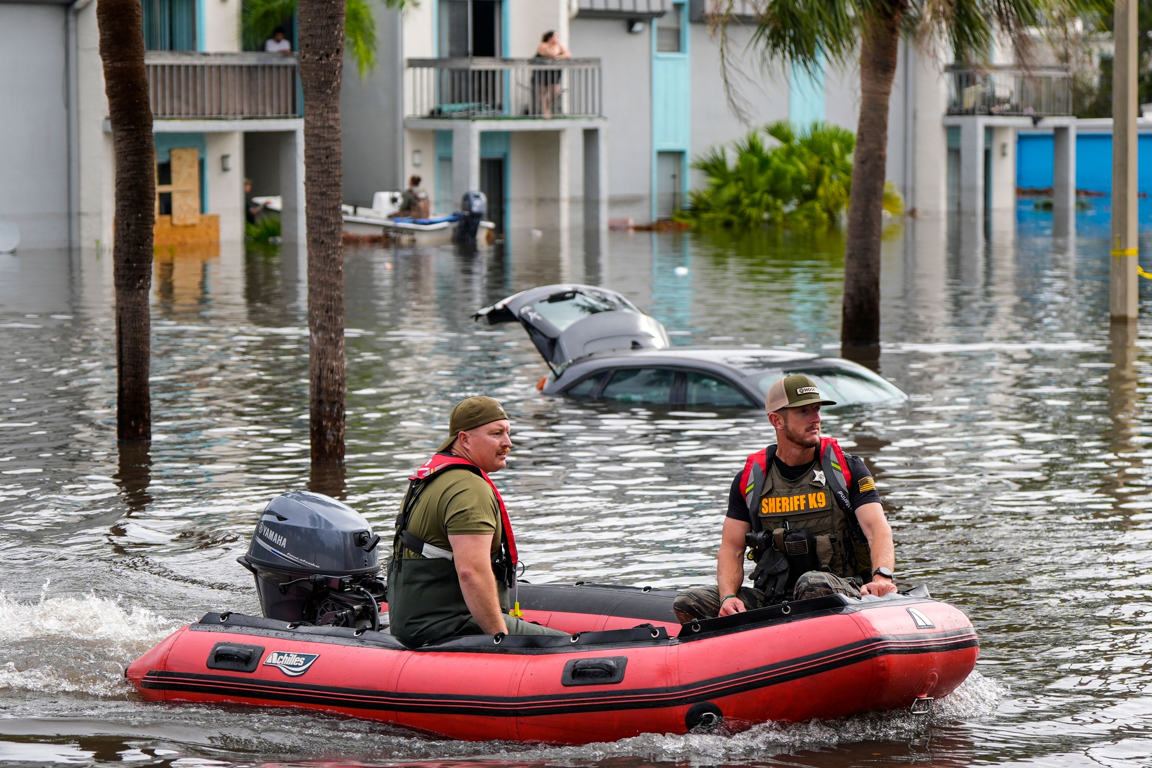 A water rescue boat moves in floodwaters at an apartment complex in the aftermath of hurricane Milton, Thursday, Oct. 10, 2024, in Clearwater, Fla. (AP Photo/Mike Stewart)