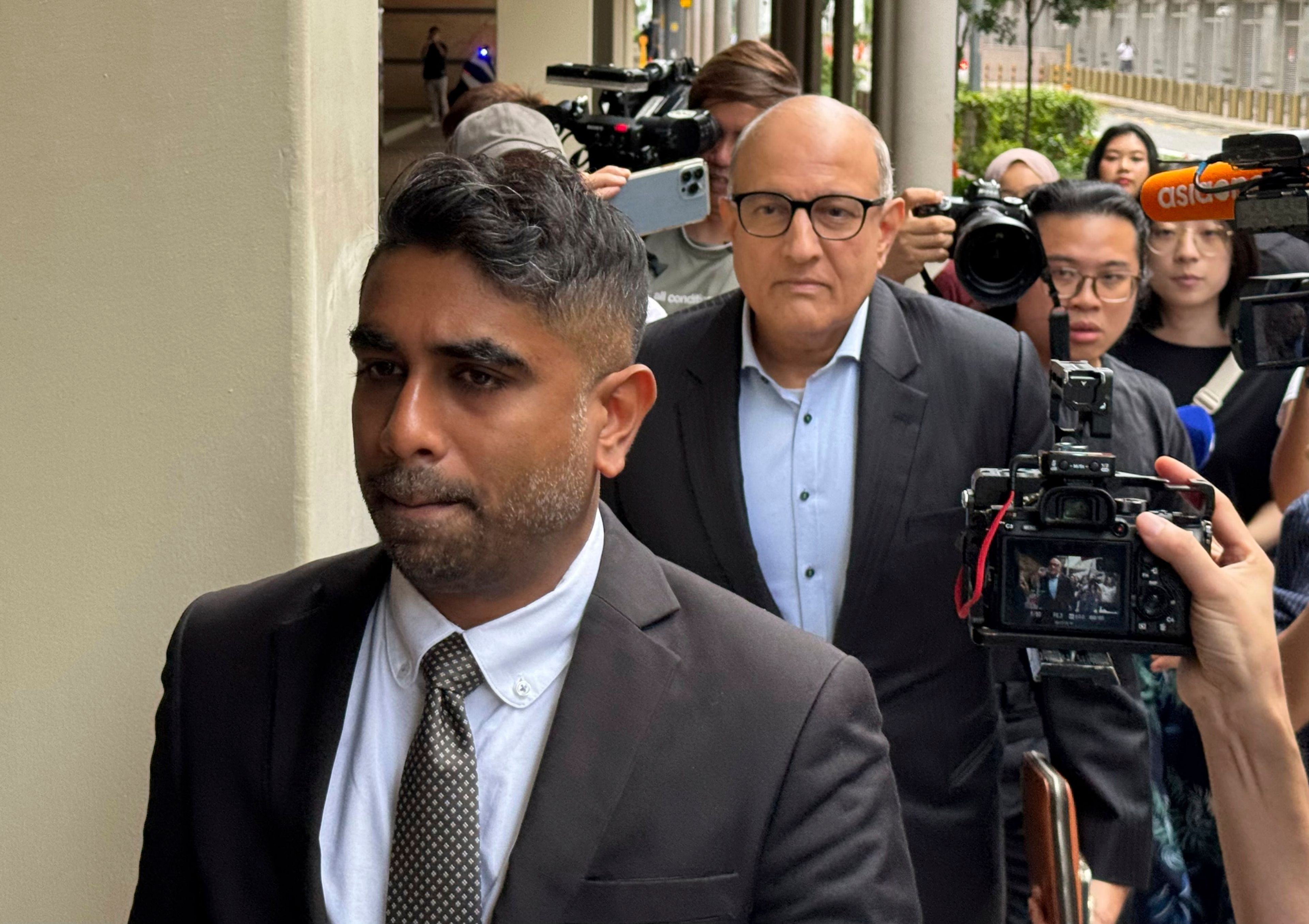 Former Transport Minister S. Iswaran, left, and his lawyer Mr. Navin Thevar arrive at the High Court in Singapore, July 5, 2024. (AP Photo)