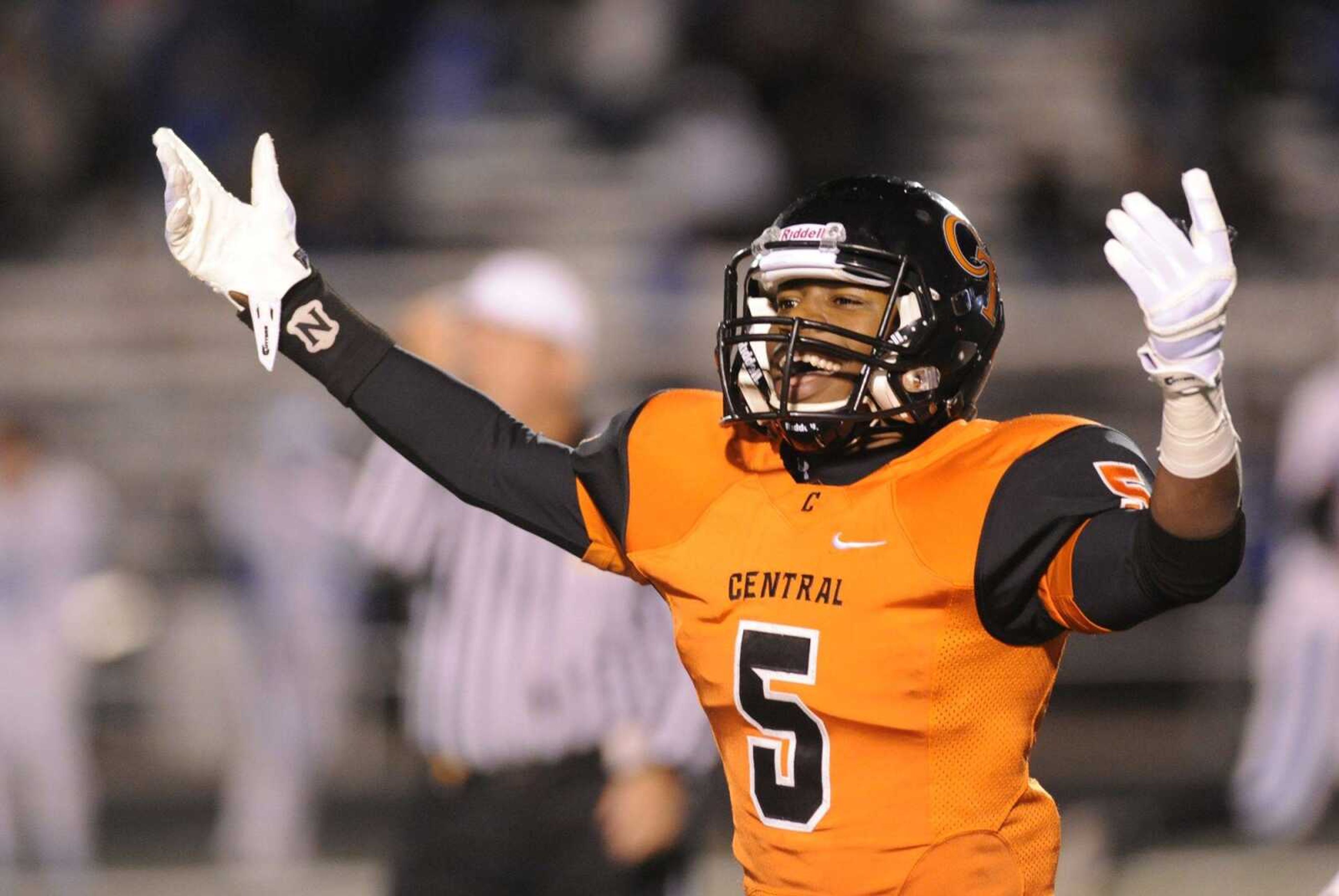 Central's Nikylus Thompson turns to the fans to celebrate after Central scored a touchdown in the fourth quarter against Hillsboro during the Class 4 District 1 championship Friday, Nov. 7, 2014 at Central. (Glenn Landberg)