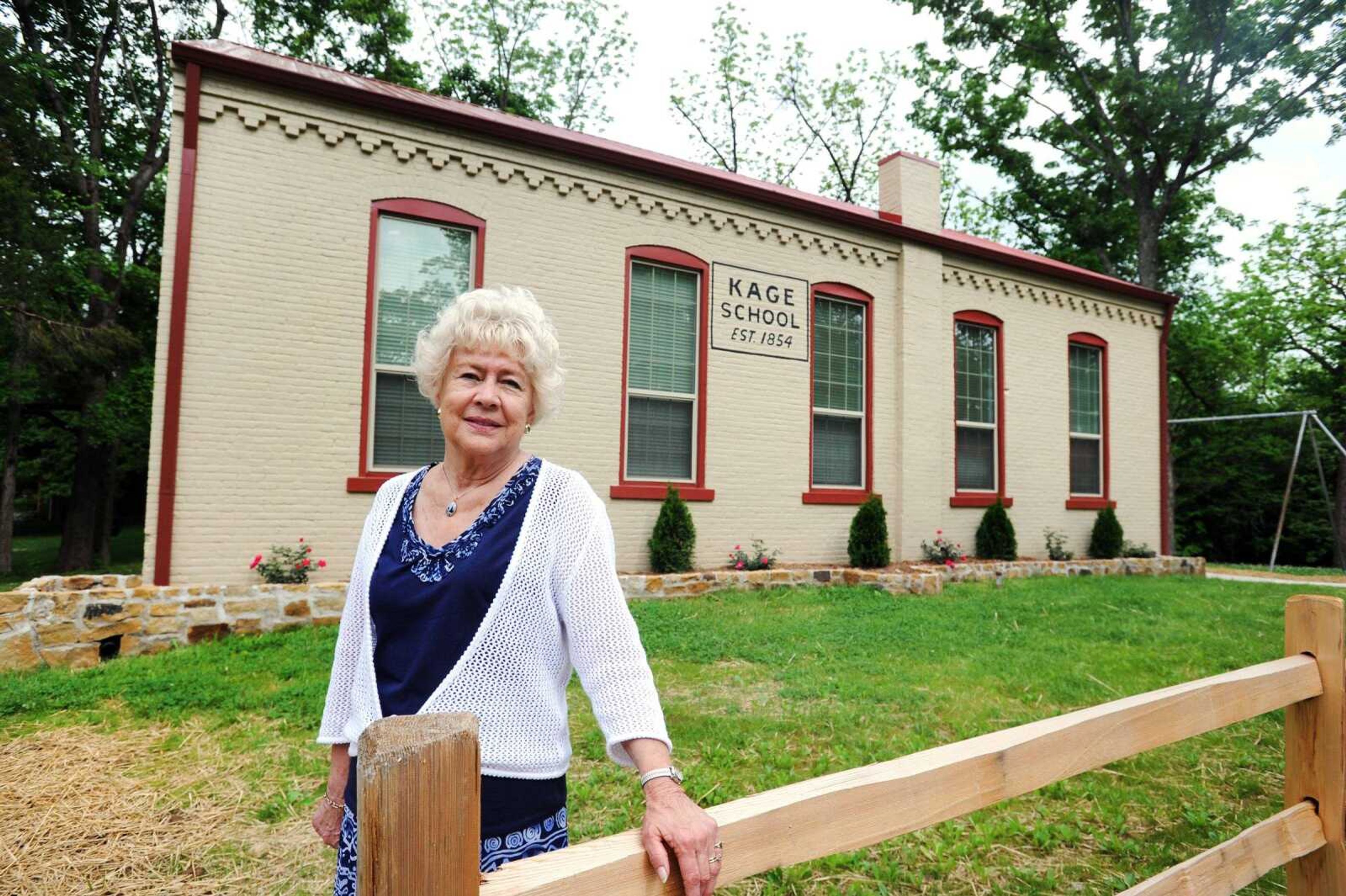 Joanna Proctor stands outside the newly renovated Kage School, May 10. Proctor attended the one-room schoolhouse in Cape Girardeau in the early 1940s. (Laura Simon)