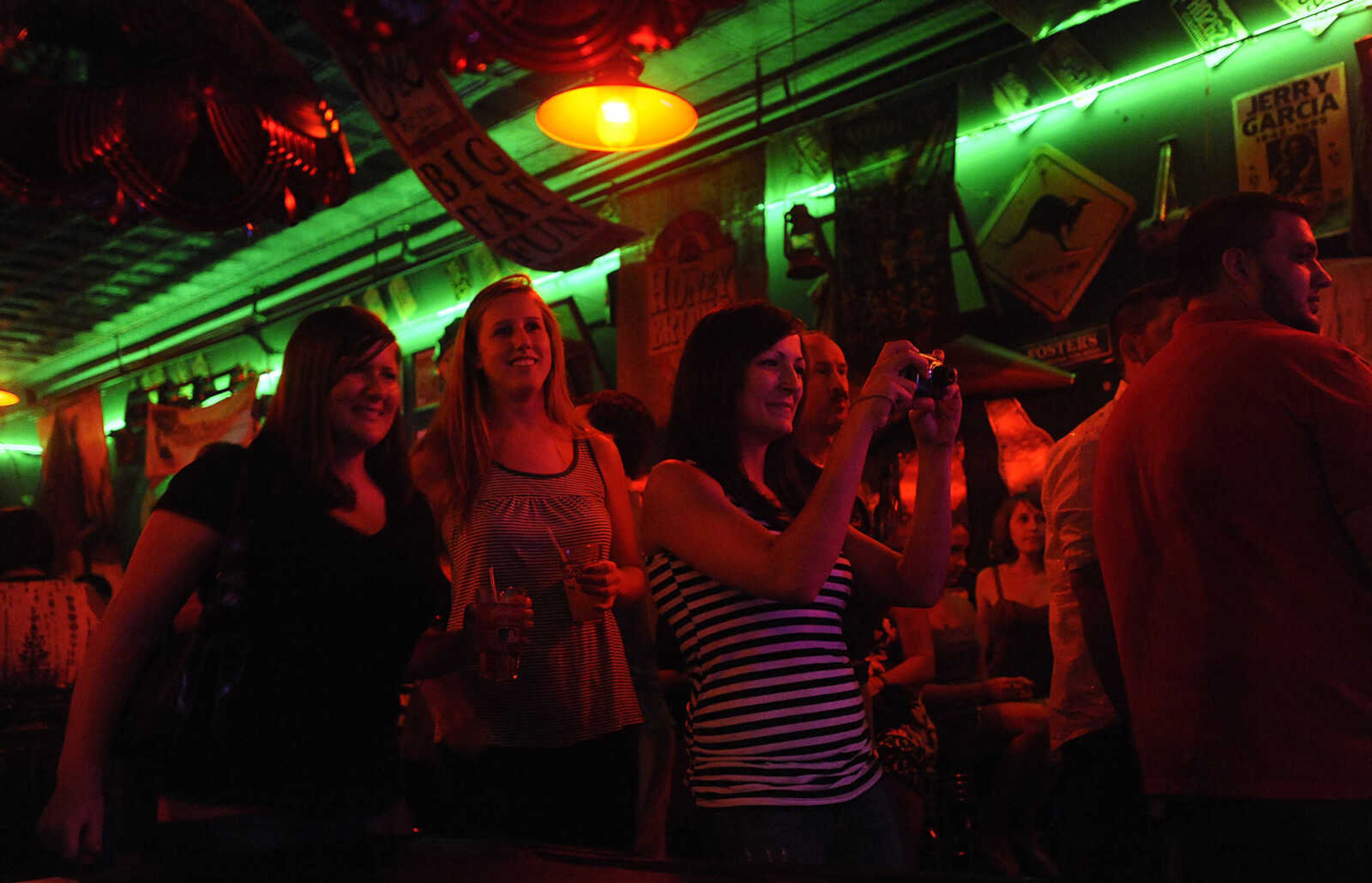 Fans take photos as the Mike Renick Band performs at the Rude Dog Pub, 123 Main Street, Friday, June 22.