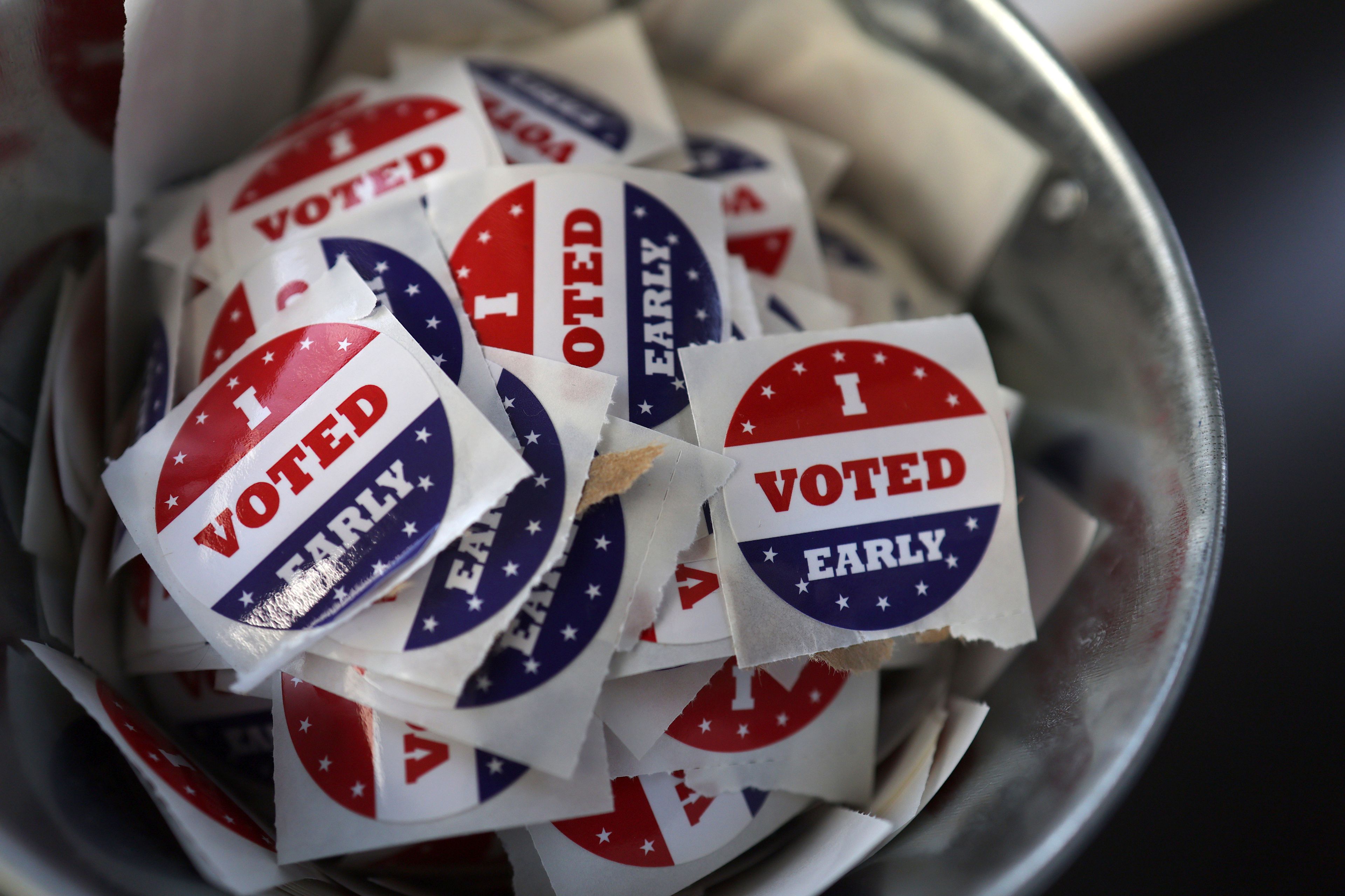 "I Voted Early" stickers sit in a bucket by the ballot box at the City of Minneapolis early voting center, Thursday, Sept. 19, 2024, in St. Paul, Minn. In-person voting in the 2024 presidential contest begins Friday in three states, including Democratic vice presidential candidate Tim Walz's home state of Minnesota, with just over six weeks left before Election Day. (AP Photo/Adam Bettcher)