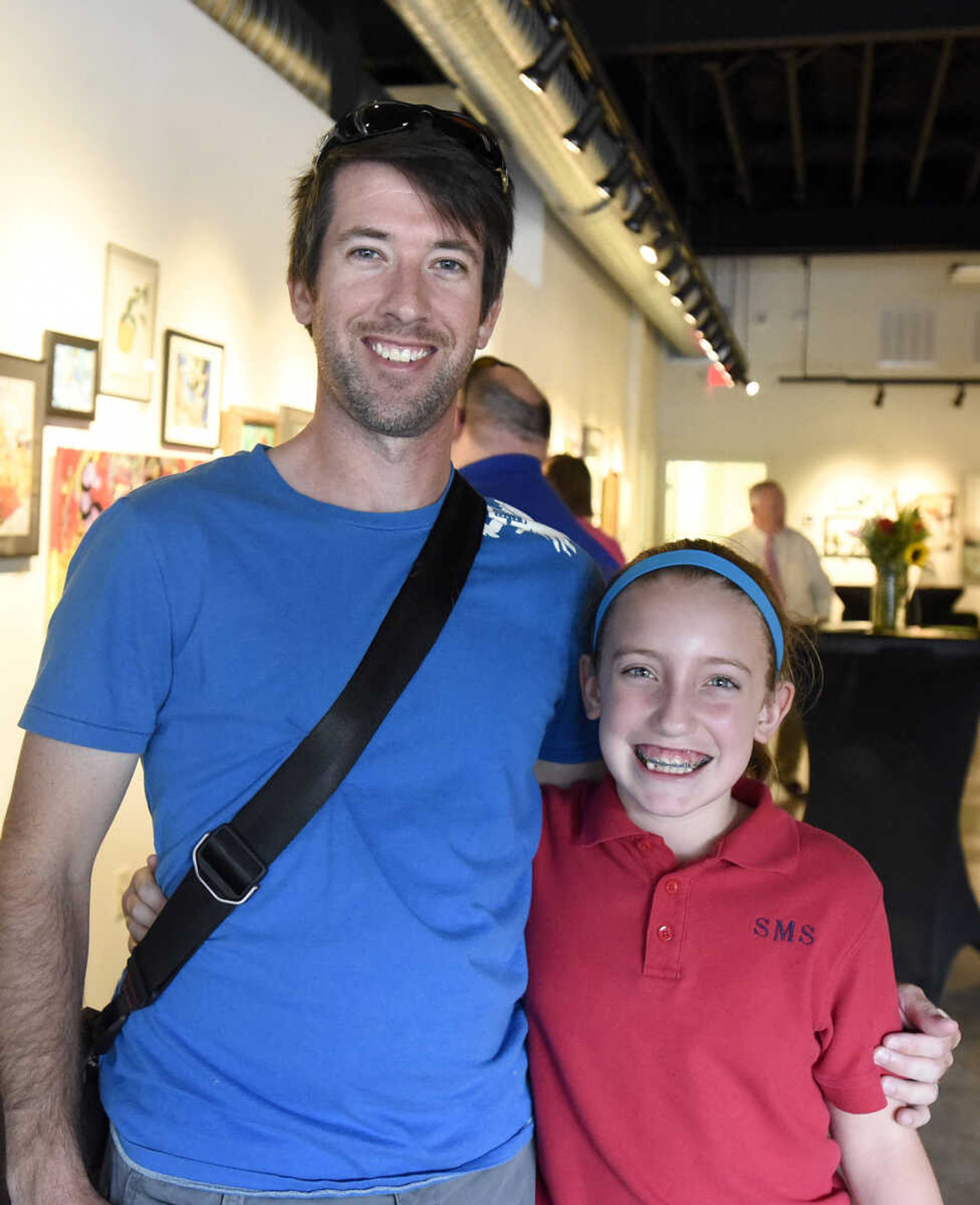 LAURA SIMON ~ lsimon@semissourian.com

Tim Buerck and his daughter Bella pose for a photo during the grand opening reception for the 4th annual Members Exhibit at the Arts Council of Southeast Missouri in its new location at 16 North Spanish Street in downtown Cape Girardeau on Friday, Sept. 2, 2016.