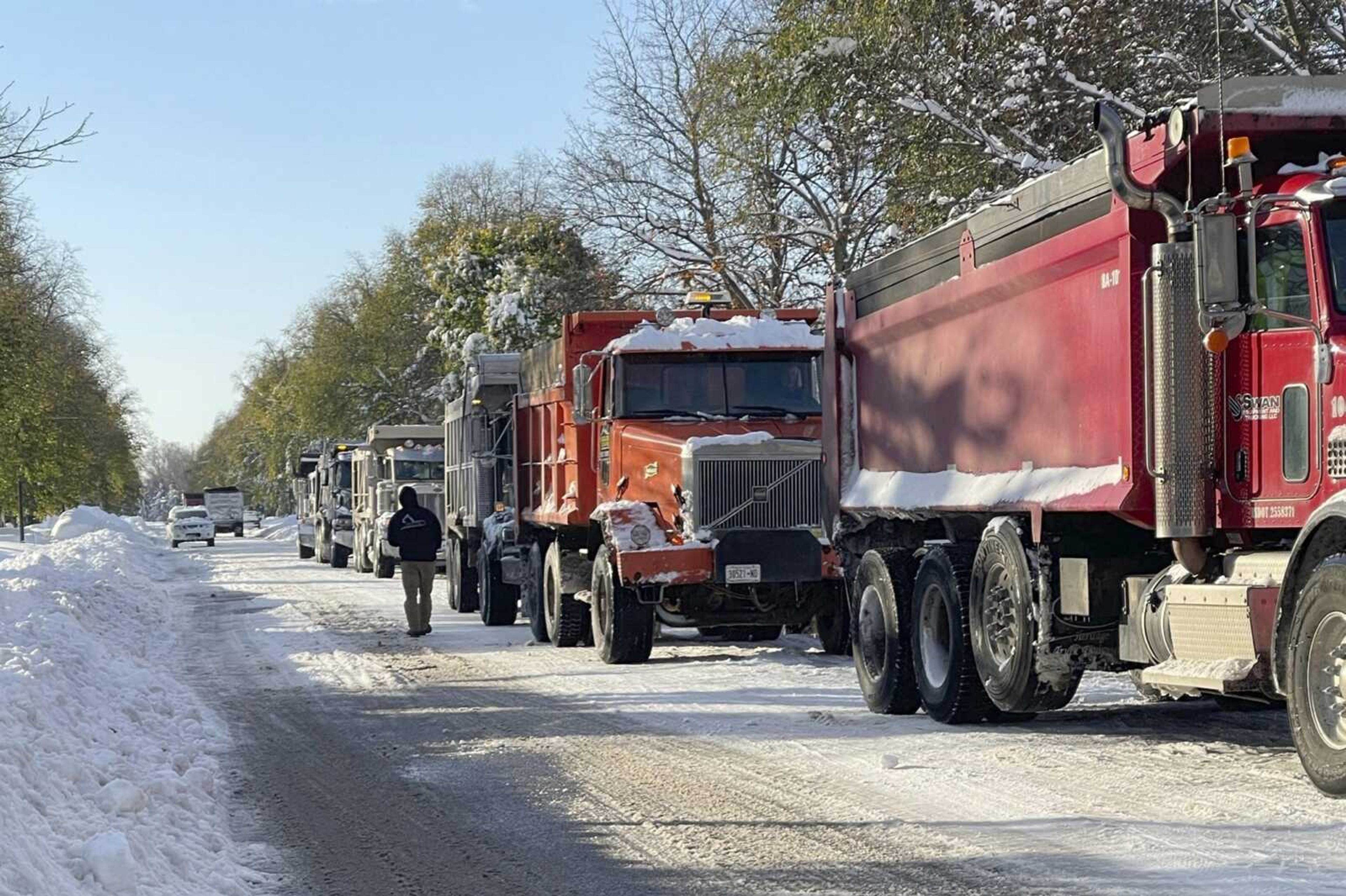 Snow covers the ground Saturday in Buffalo, New York, as crews work to clear the streets.