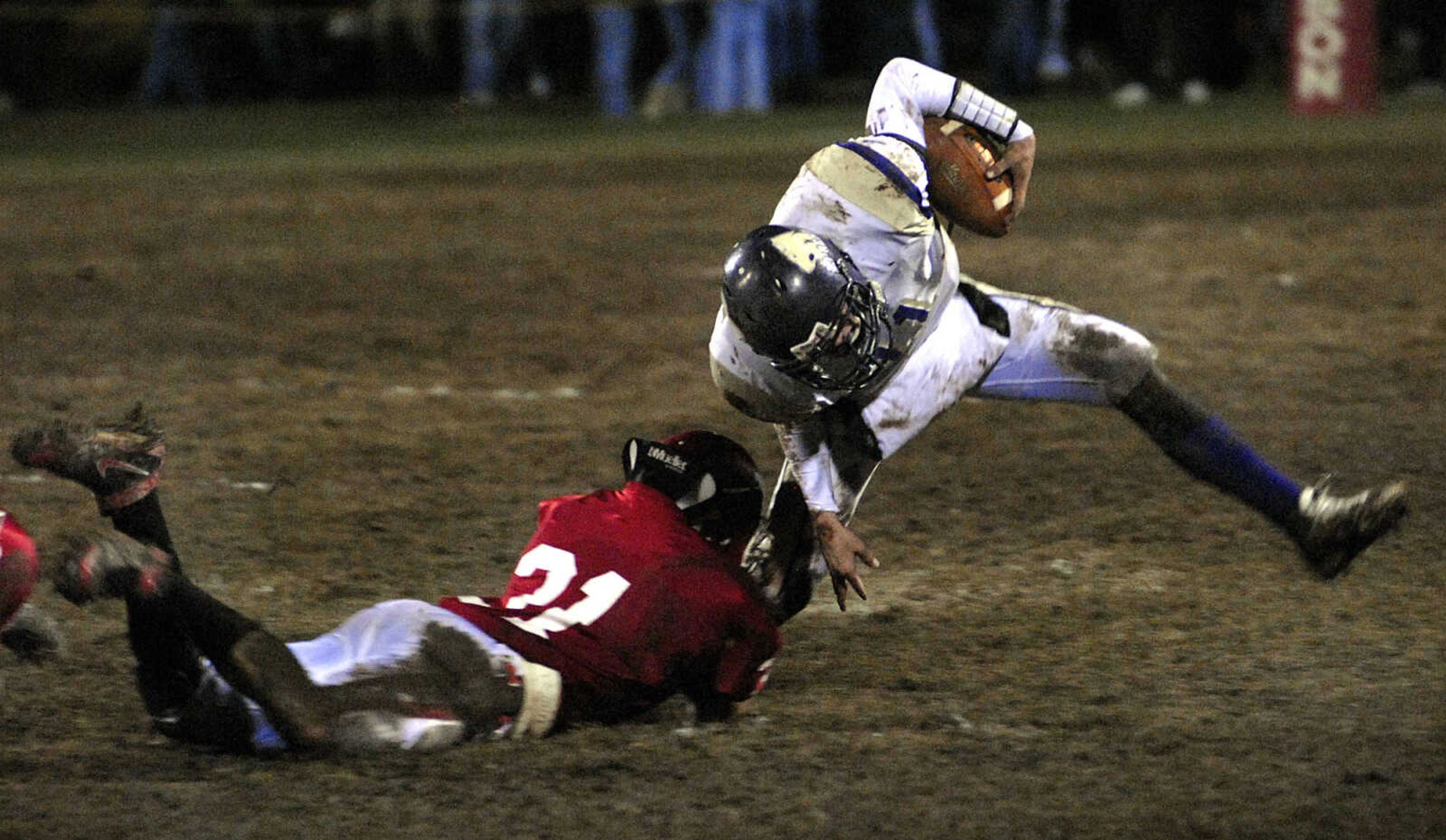 FRED LYNCH ~ flynch@semissourian.com
Jackson defender Cole Rodgers grabs Eureka's Chase Bollinger during the first quarter Friday at Jackson.