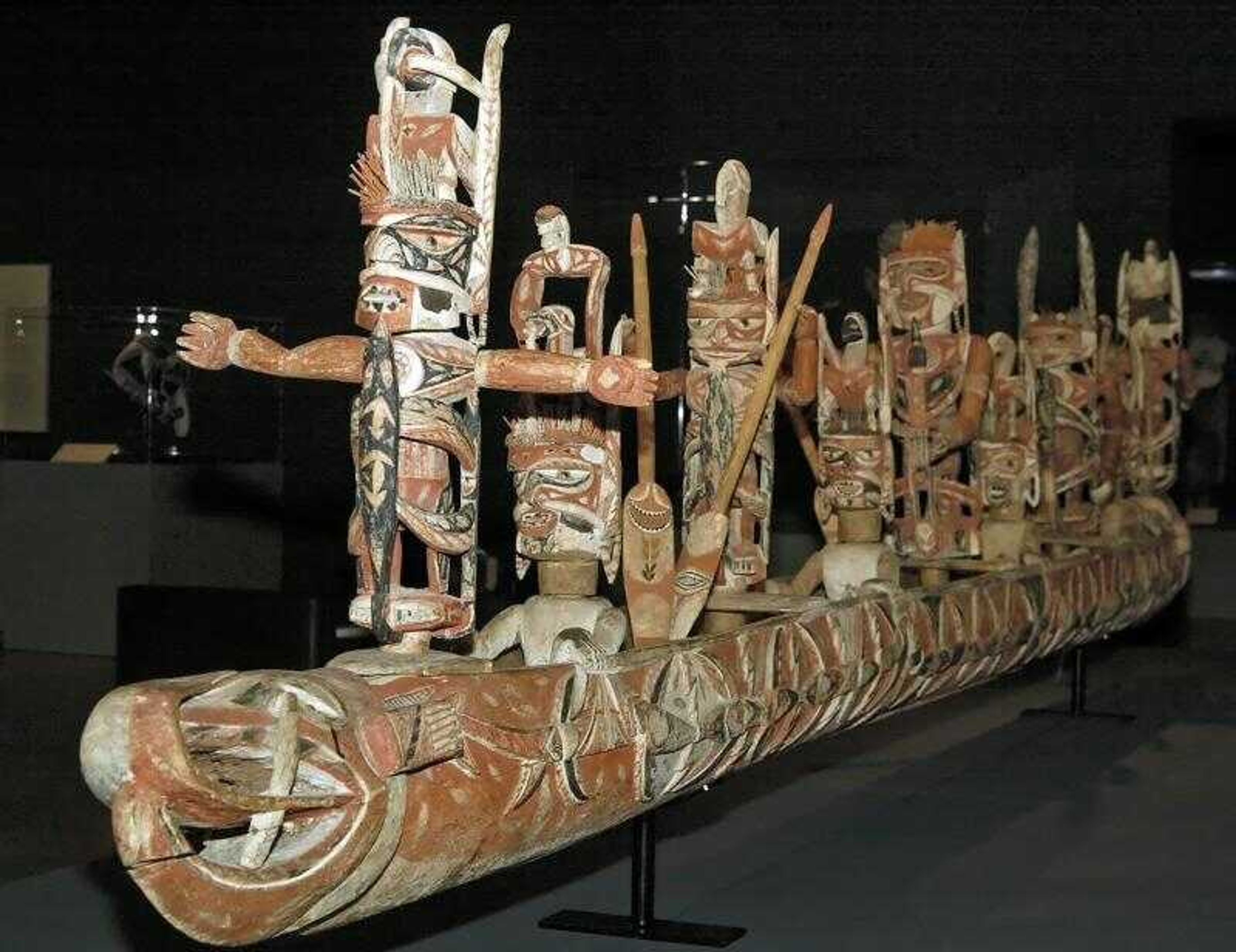 A large canoe depicting men being taken to the afterlife by a large fish is one of many works at the St. Louis Art Museum's "New Ireland: Art of the South Pacific" exhibit at the museum in St. Louis.
