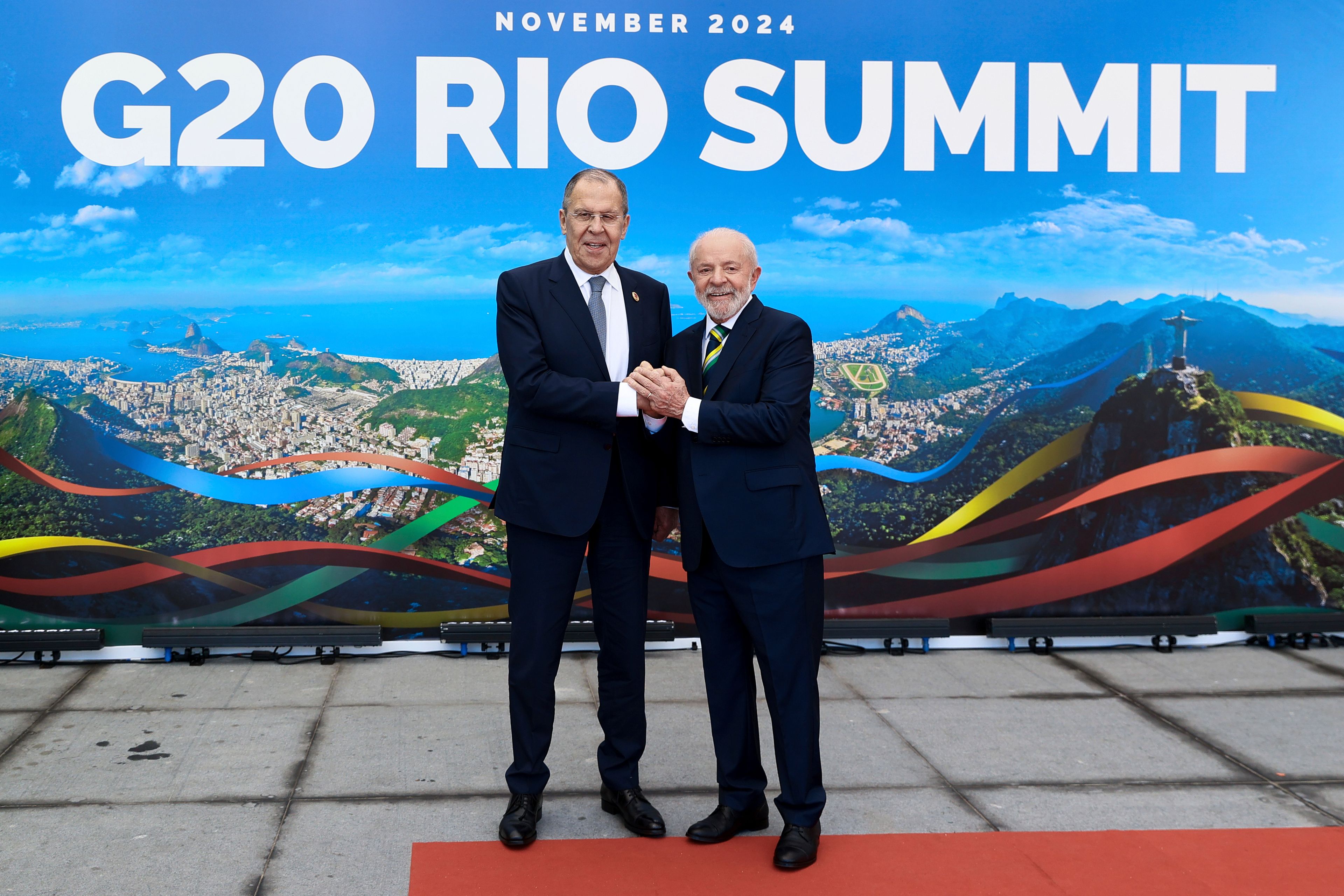 In this photo released by Russian Foreign Ministry Press Service, Russia's Foreign Minister Sergey Lavrov, left, and Brazil's President Luiz Inacio Lula da Silva pose for a photo on the sidelines of the G20 Summit leaders meeting in Rio de Janeiro, Monday, Nov. 18, 2024. (Russian Foreign Ministry Press Service via AP)