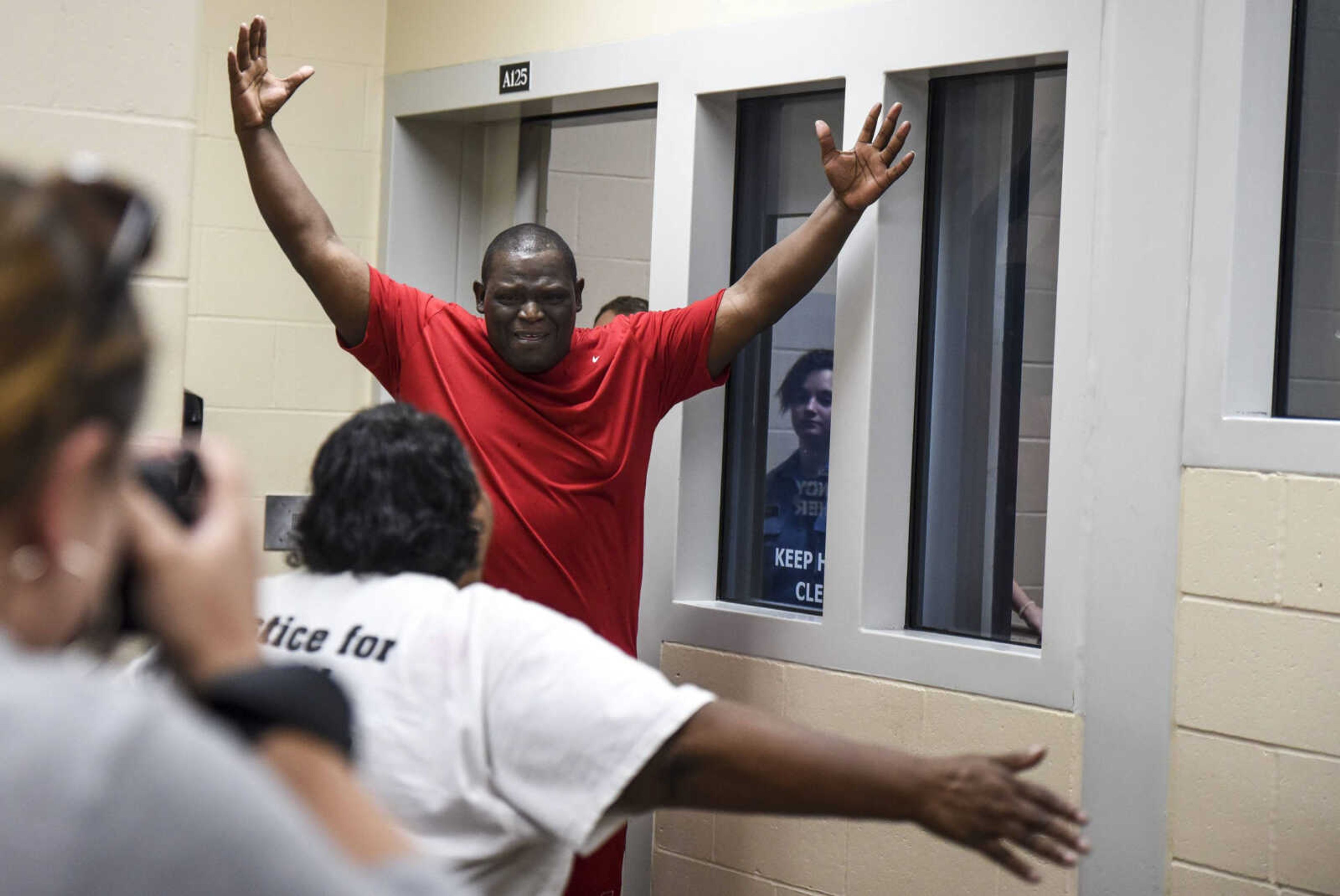 David Robinson runs to hug his mother, Jennett McCaster, after being released from the Jefferson City Correctional facility Monday in Jefferson City, Missouri.