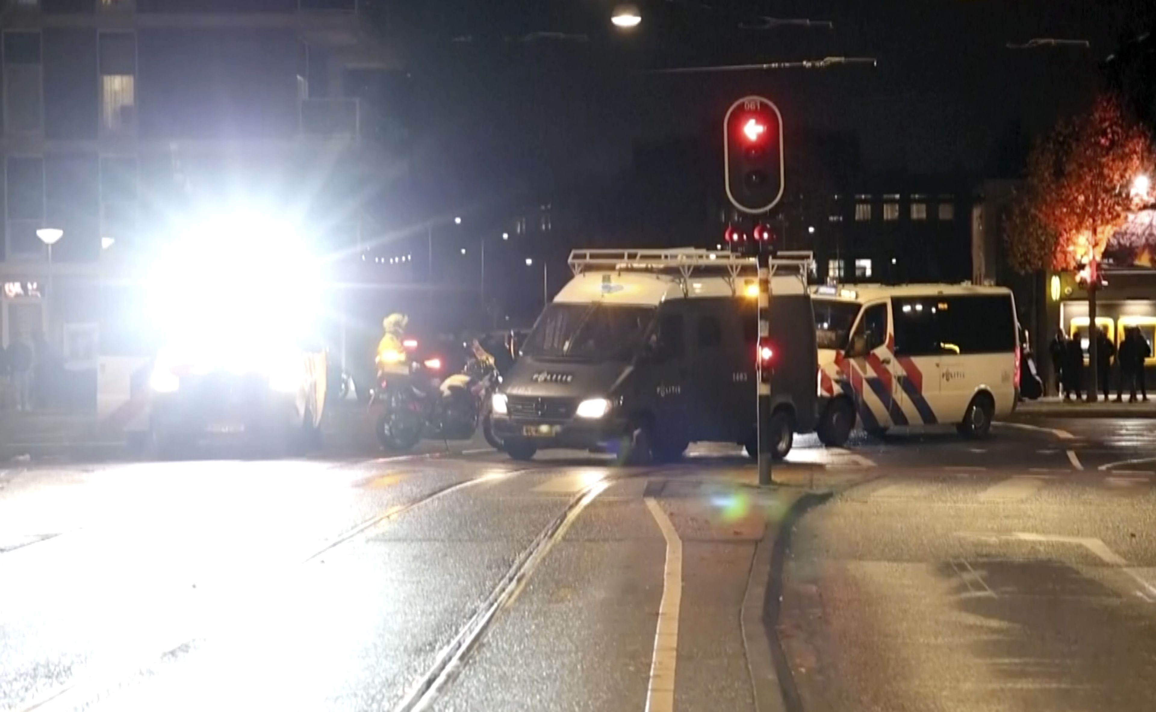 In this image taken from video, police vehicles and personnel patrol the streets of Amsterdam, Monday Nov. 11, 2024, as the city is facing tensions following violence last week. (AP Photo)