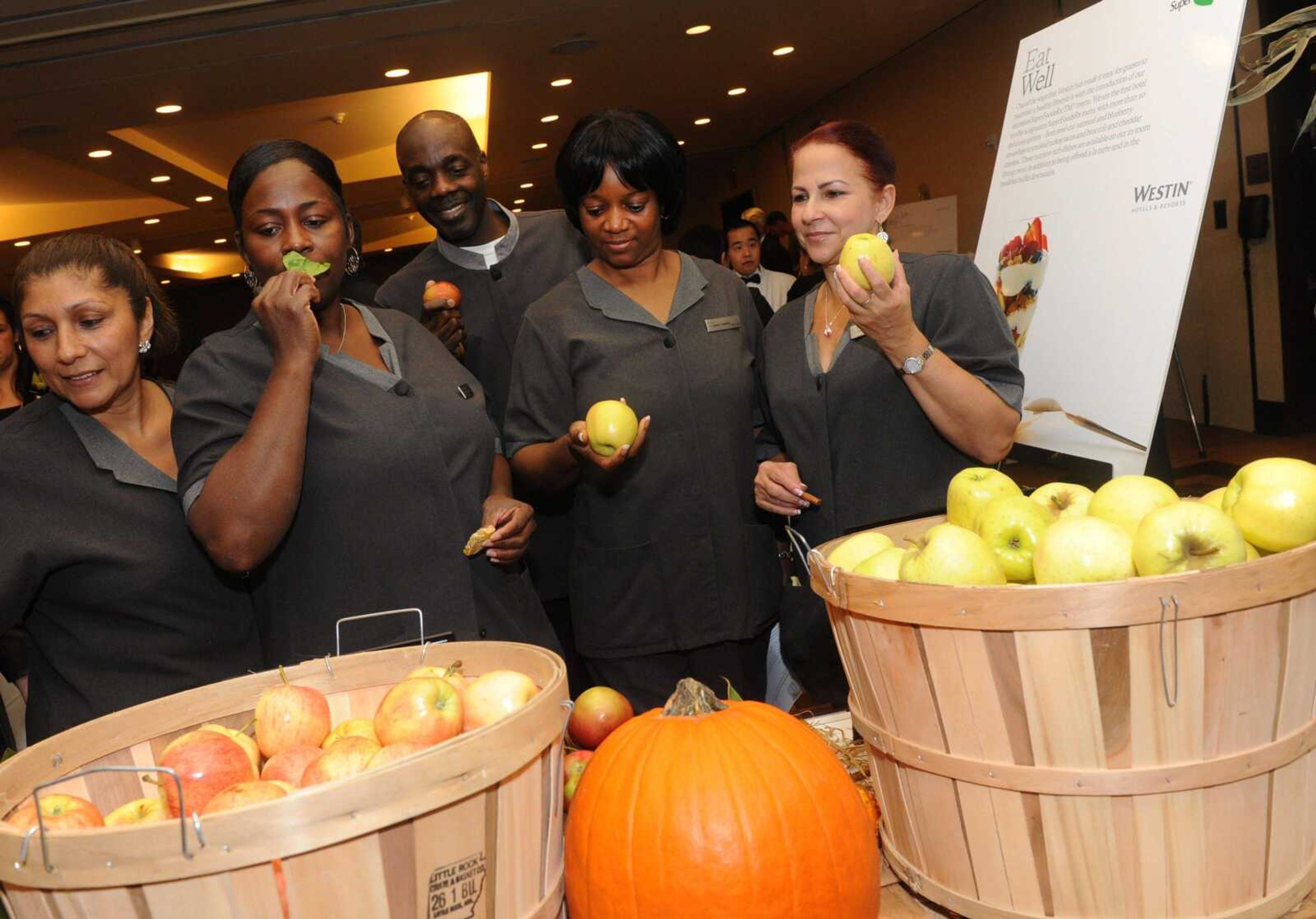 Westin Hotels &amp; Resorts employees sample a variety of produce brought in for the launch of a new employee Wellness program on Oct. 21, 2011. (Associated Press)