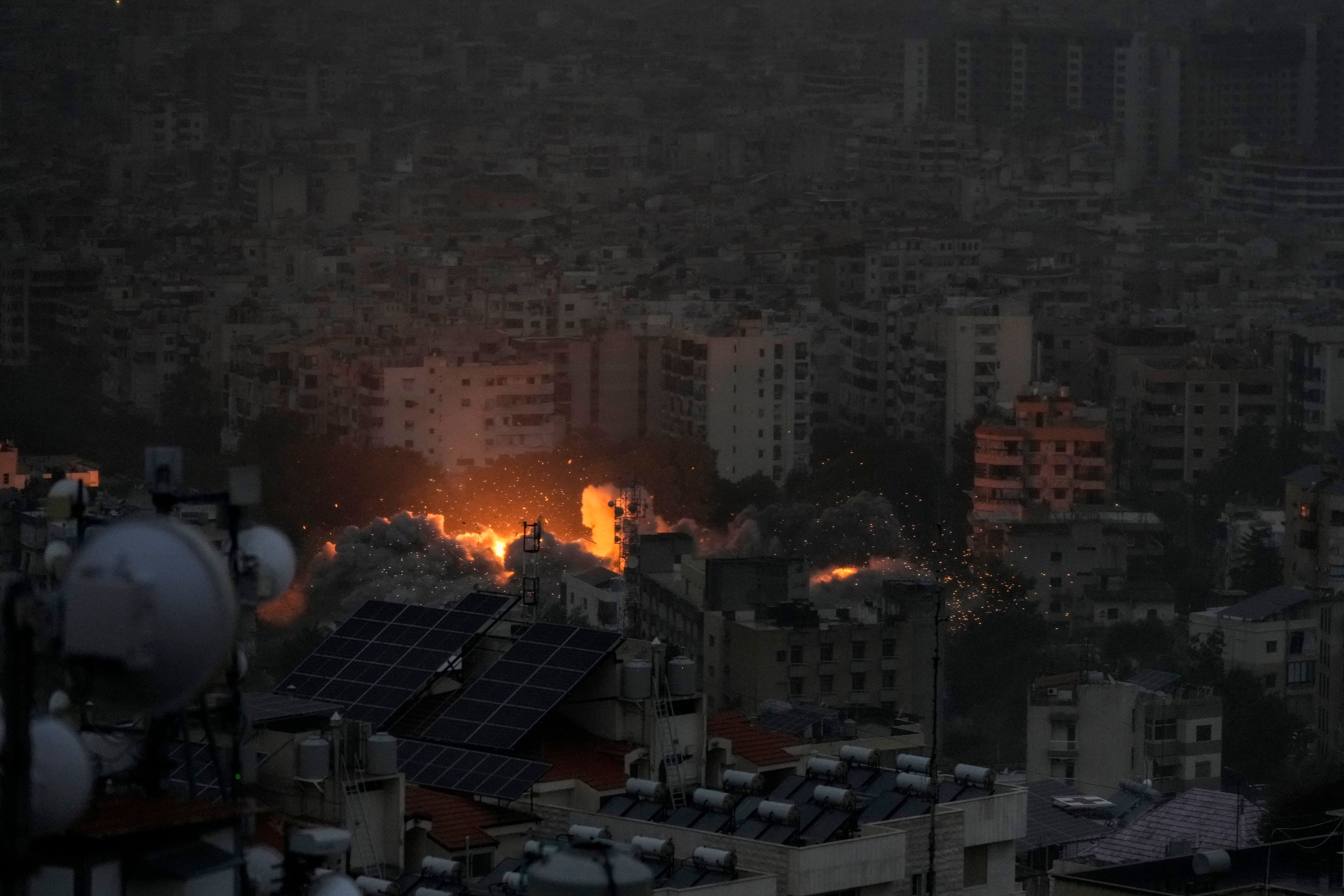 Smoke and flame rise after an Israeli airstrike on Dahiyeh, in Beirut, Lebanon, Monday, Nov. 25, 2024. (AP Photo/Bilal Hussein)