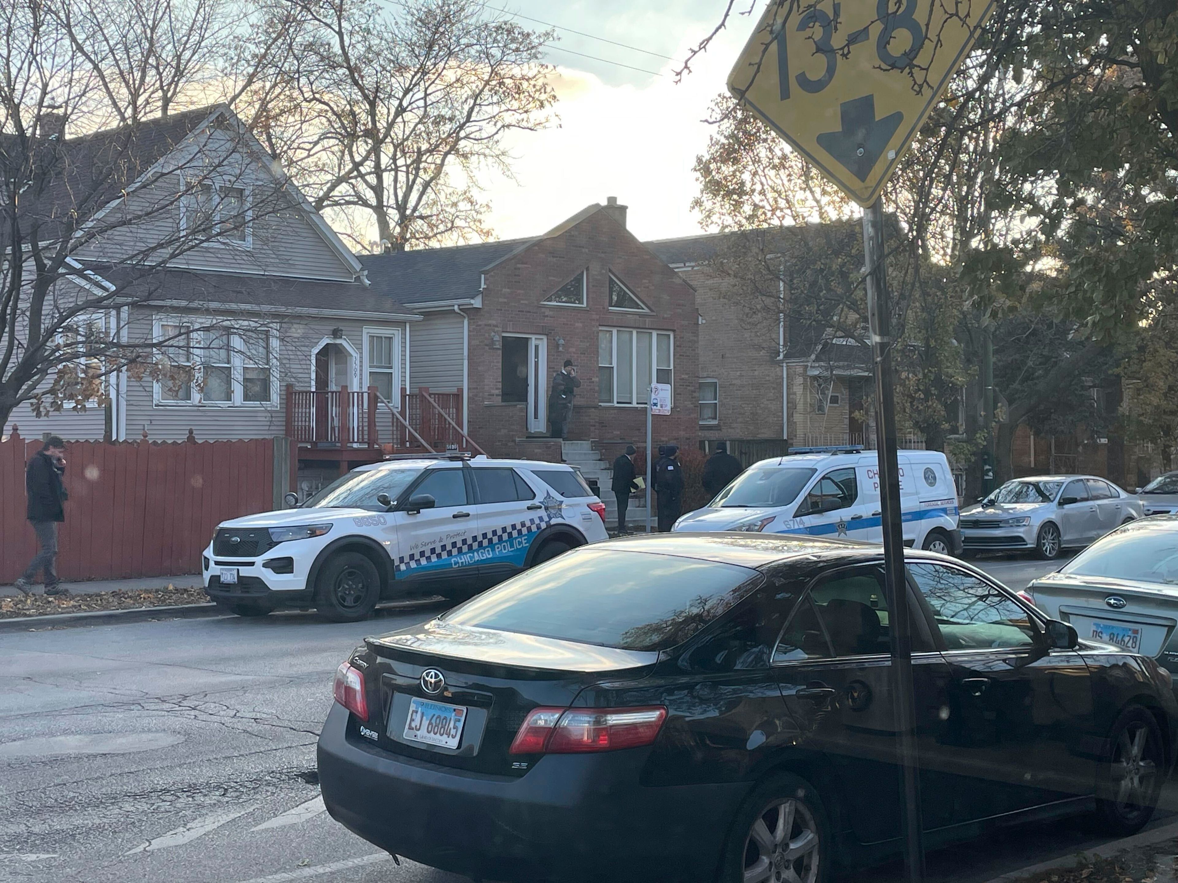 Police work on the scene after a shooting at a home in Chicago, Monday, Dec. 2, 2024. (David Struett/Chicago Sun-Times via AP)