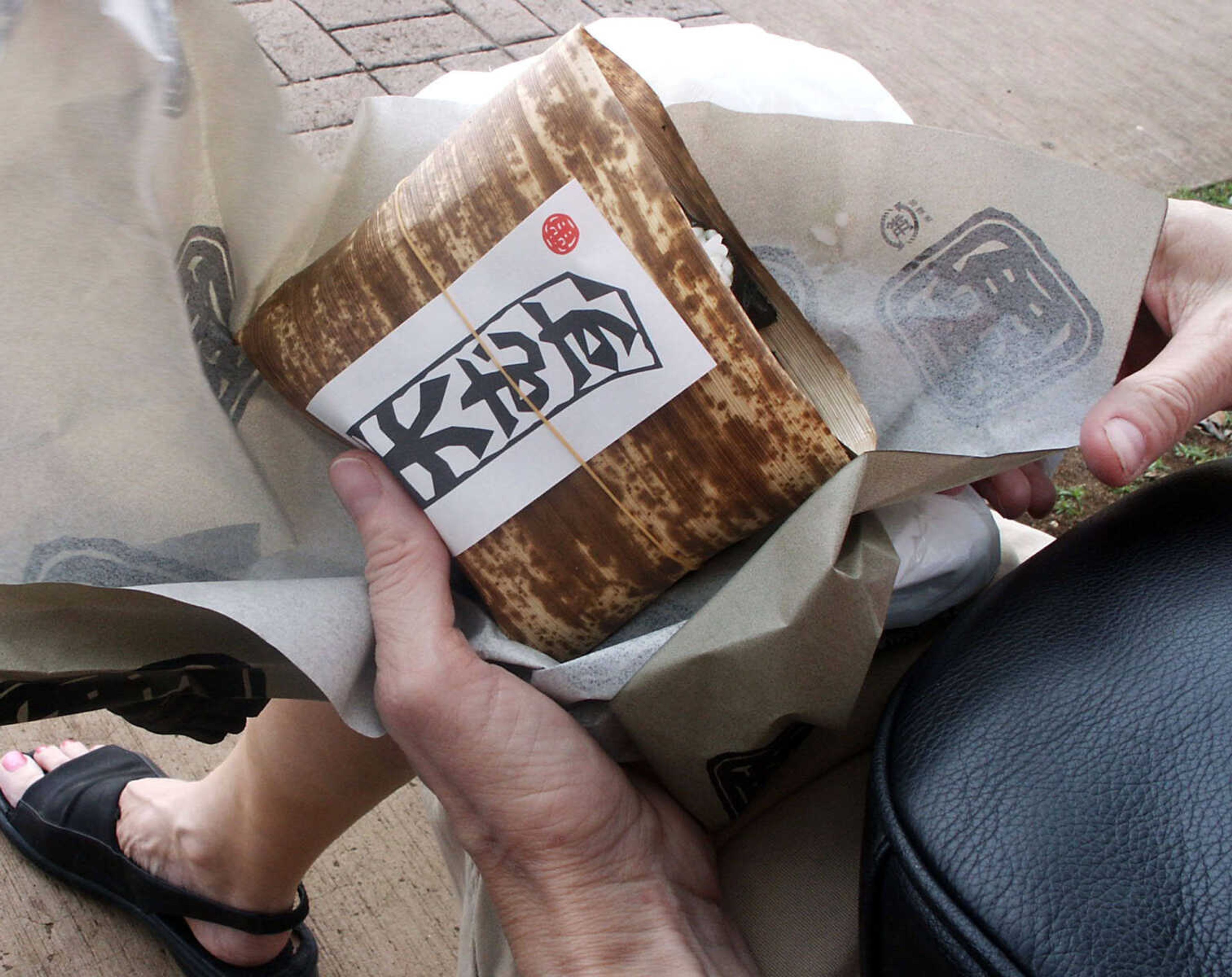 A typical rice dish, wrapped up for eating on the street or on a park bench in Honolulu.