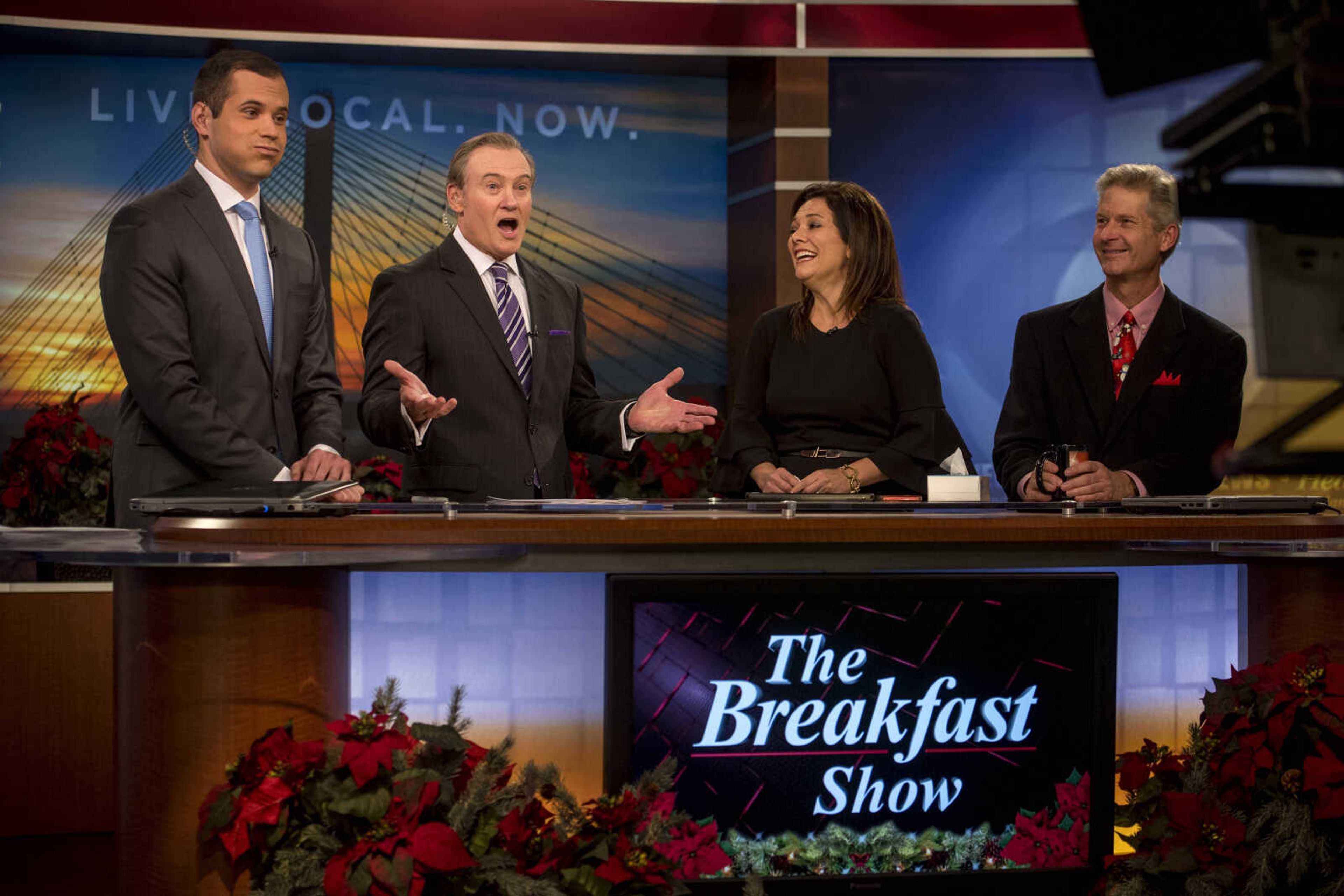 From left, anchors Justin Fischer, Jim Burns and Crystal Britt and meteorologist Brian Alworth are seen at the KFVS news desk during Burns's final morning show before retirement Friday, Dec. 21, 2018.