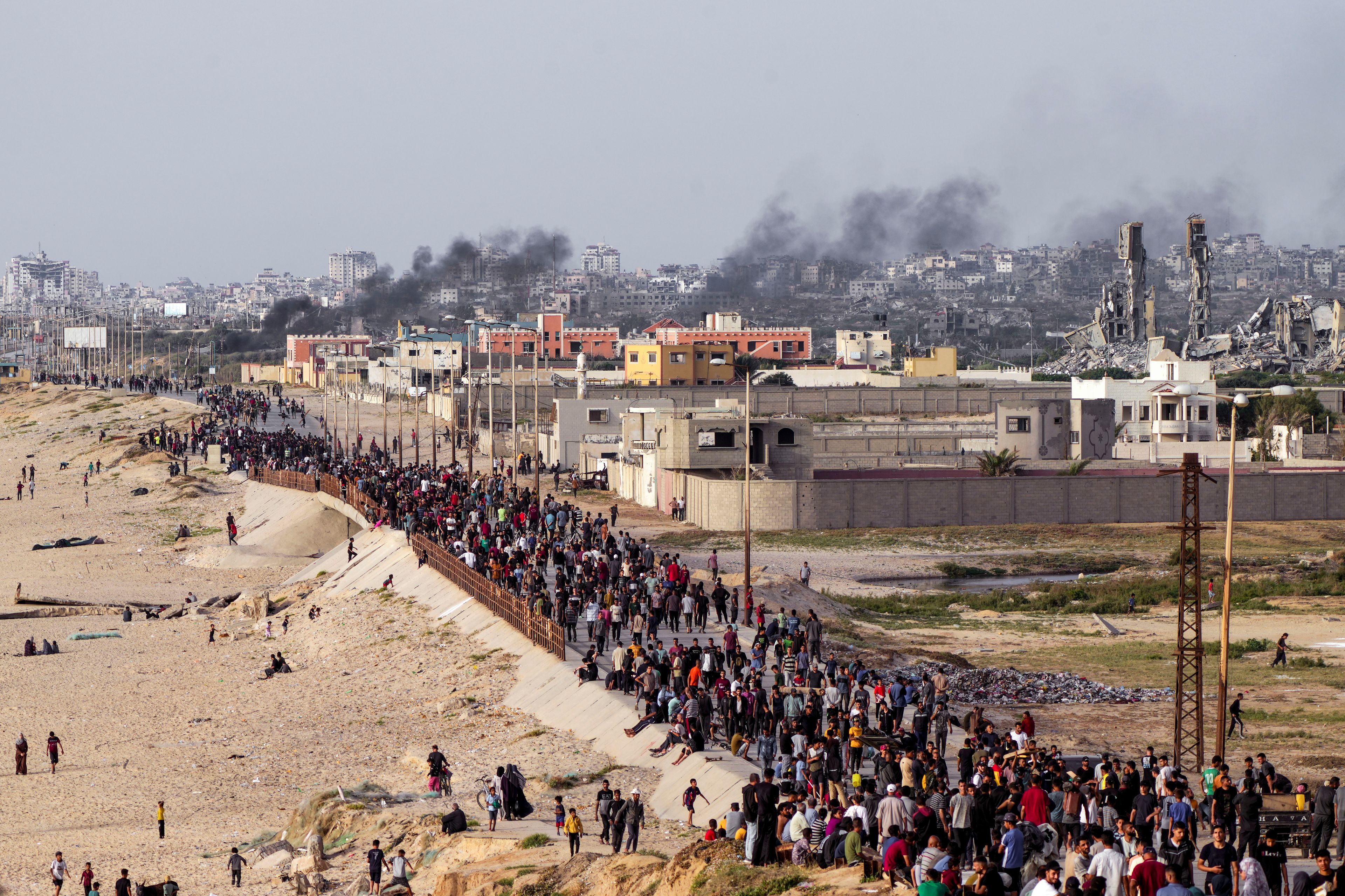 FILE - Palestinians are waiting for aid trucks to cross in central Gaza Strip on May 19, 2024. (AP Photo/Abdel Kareem Hana, File)