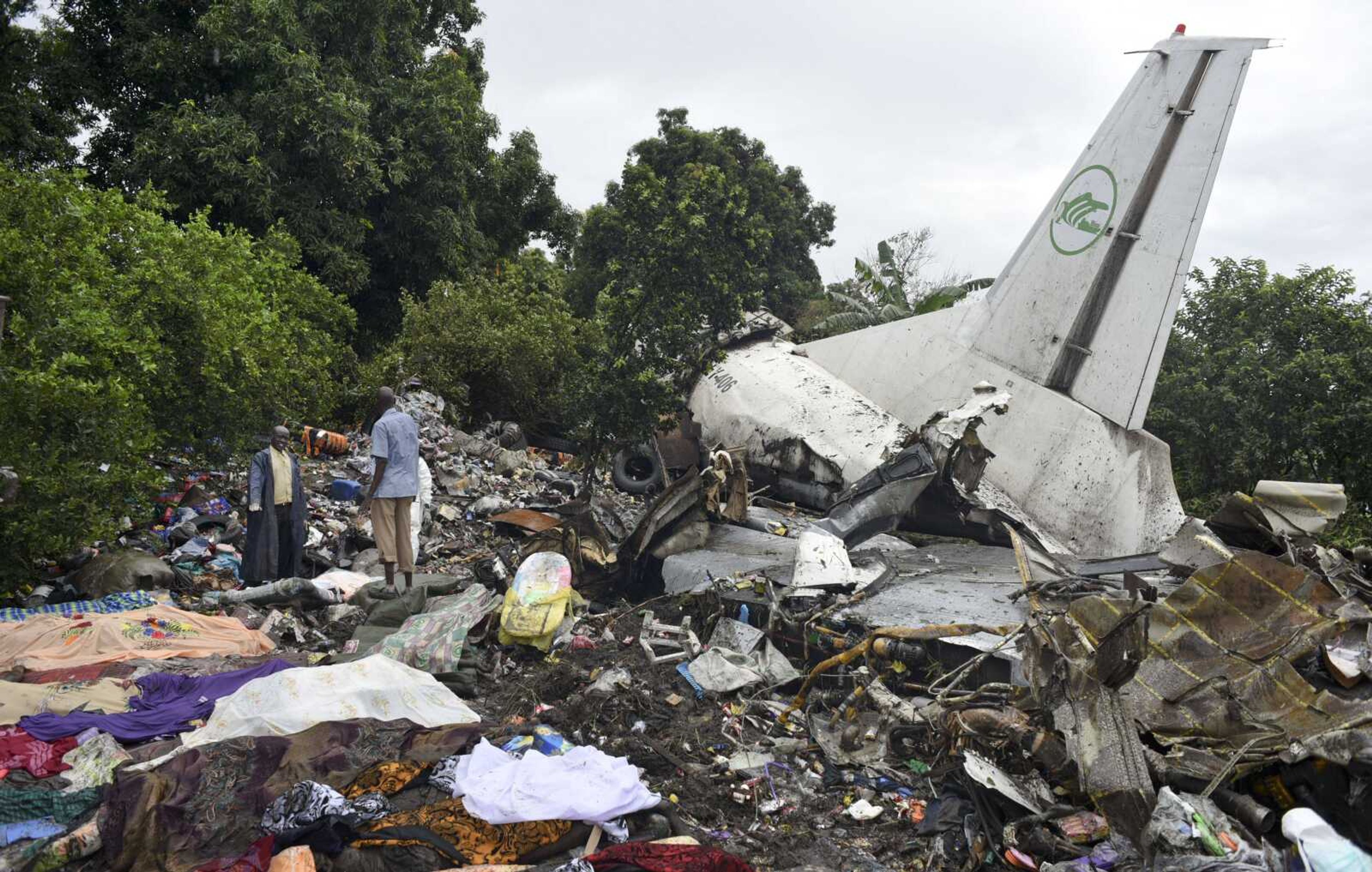 Responders pick through the wreckage of a cargo plane that crashed Wednesday in Juba, South Sudan. (Jason Patinkin ~ Associated Press)