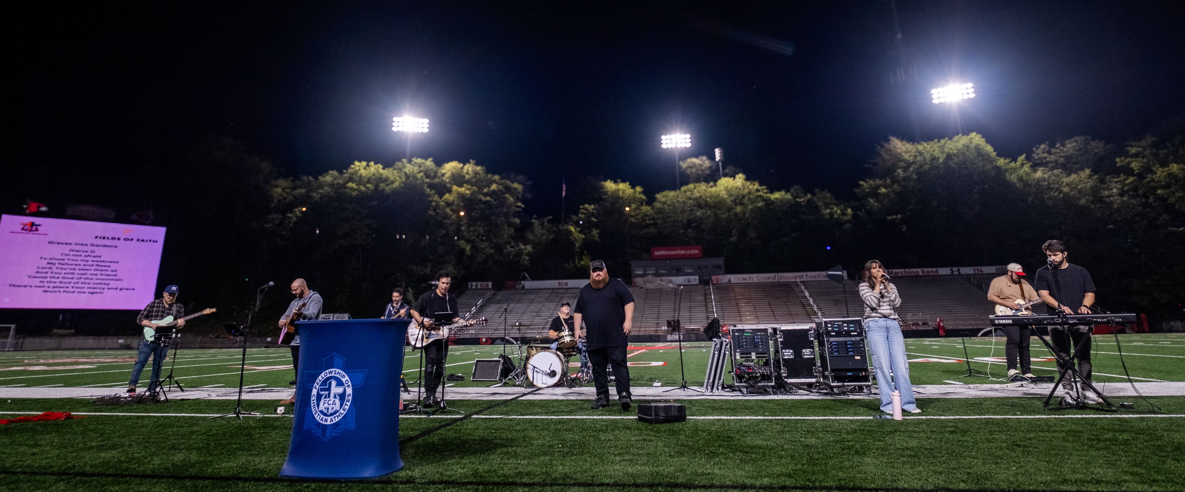 The worship band, a blend of musicians from different backgrounds, come together to lead the crowd in a night of worship.
