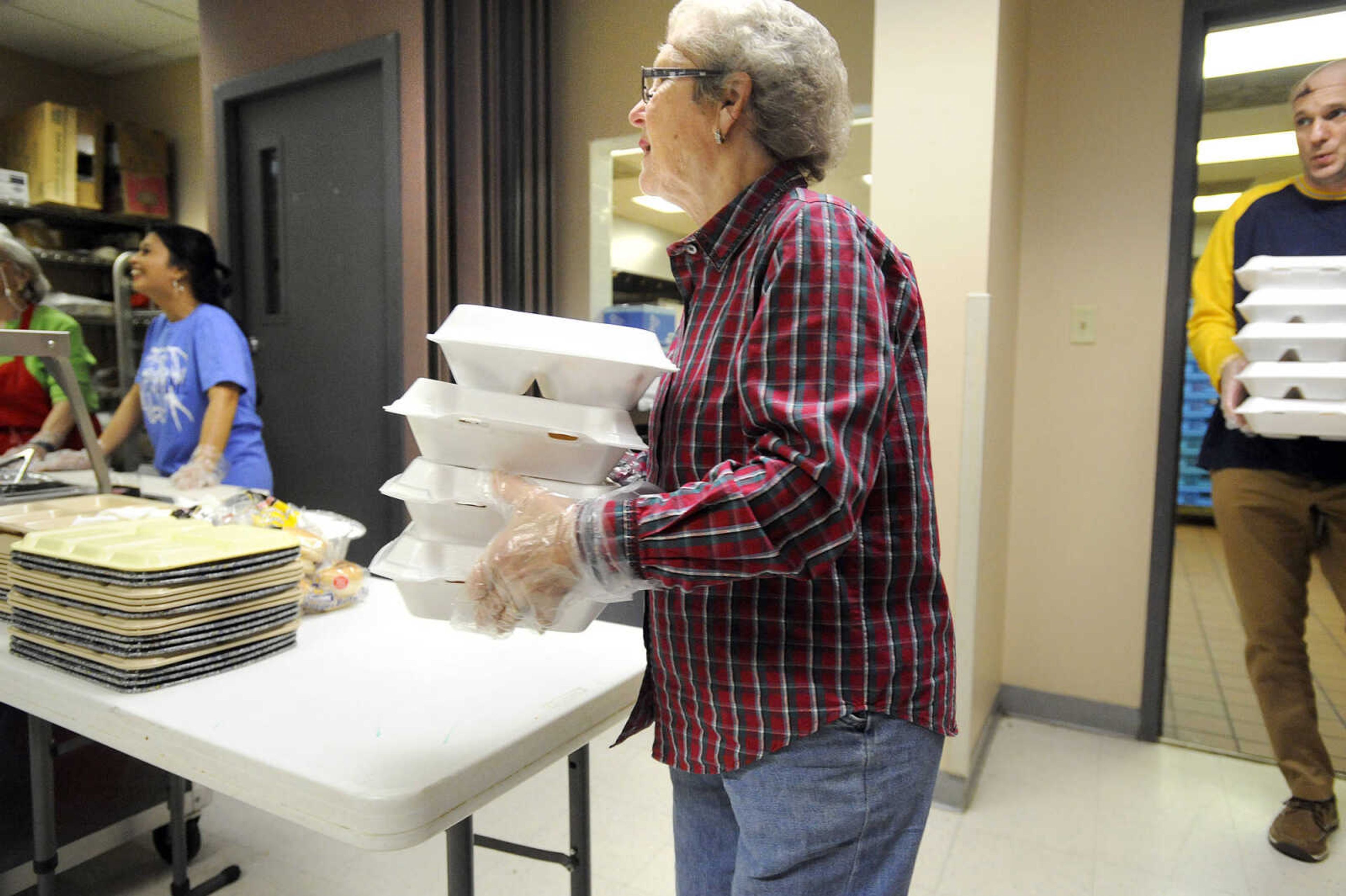 LAURA SIMON ~ lsimon@semissourian.com

Ethel Mize and David Mueller deliver carryouts to people Monday afternoon, Feb. 22, 2016, at the Salvation Army in Cape Girardeau. The last two full weeks of the month, the Salvation Army hosts meals with friends, an event where people can come have a hot meal, and also take a meal home.