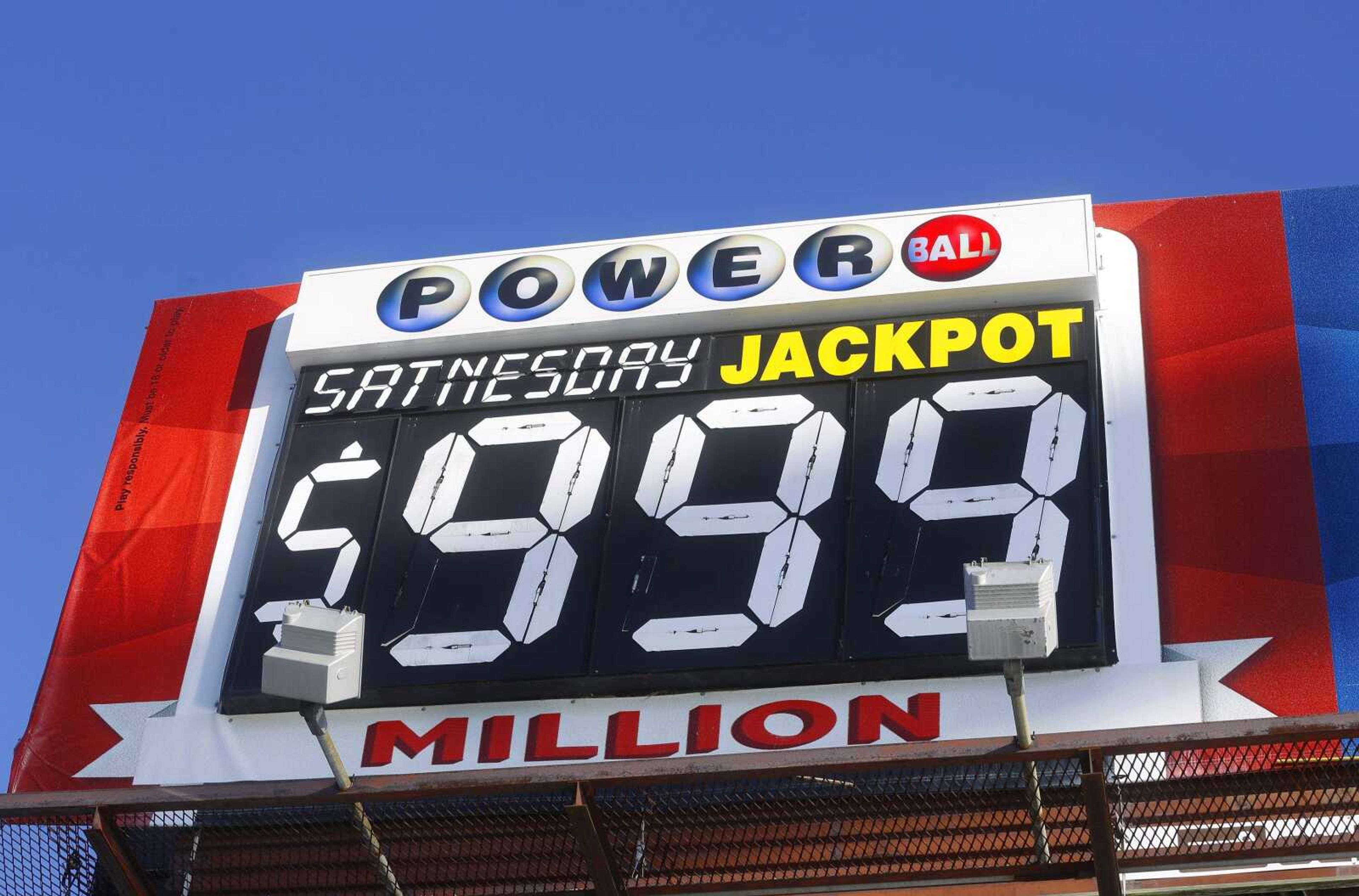 An electronic billboard advertises the Powerball lottery Tuesday in Springfield, Illinois, but can't keep up because of a lack of space to fit the growing award for the record-breaking Powerball jackpot, which has grown to more than $1 billion. (Seth Perlman ~ Associated Press)