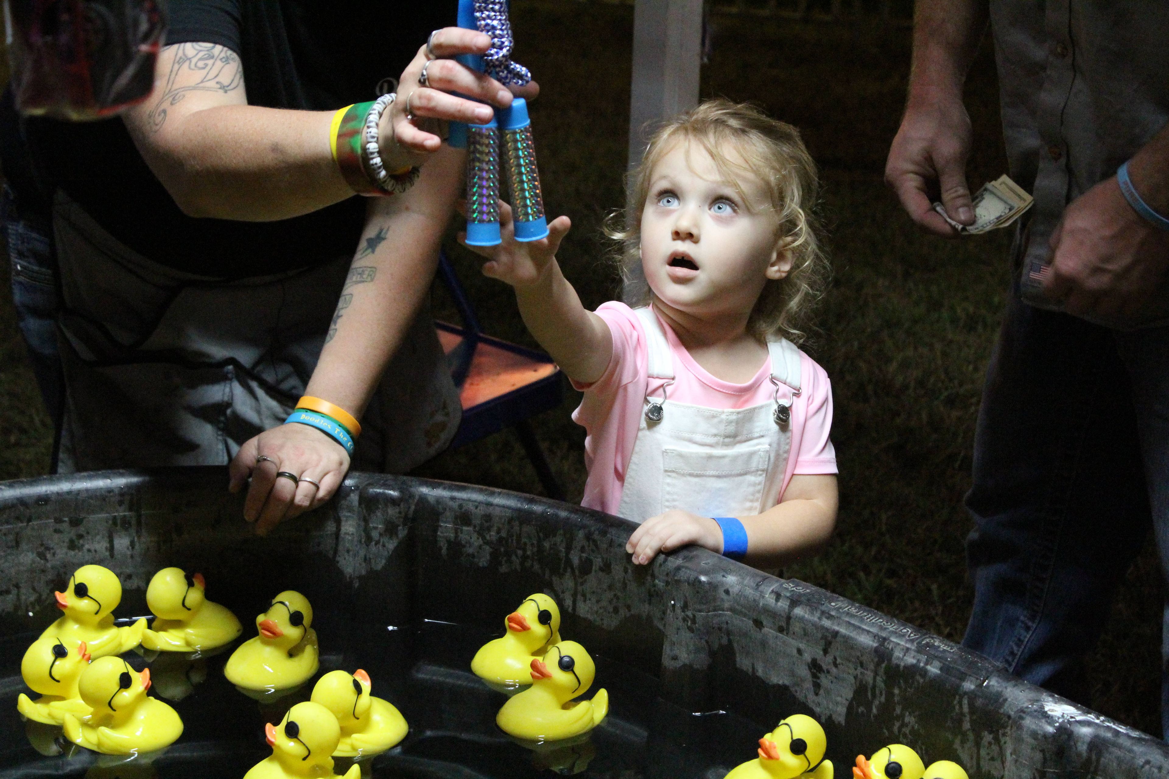 Lincoln Phillips checks out her prize options after playing the duck picking game at the Butler County Fair in 2019. 