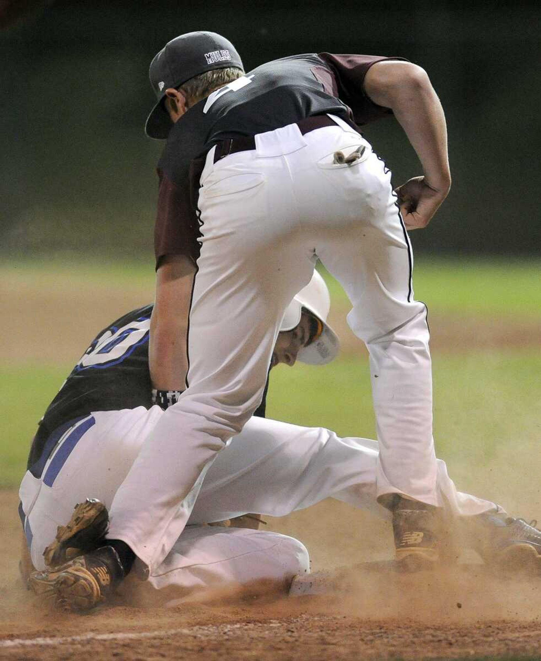 Notre Dame's Chase Urhahn steals third base as Poplar Bluff's Dalton Cooper covers on the play during the fifth inning of the SEMO Conference Tournament Monday, May 4, 2015 at Capaha Field. (Fred Lynch)