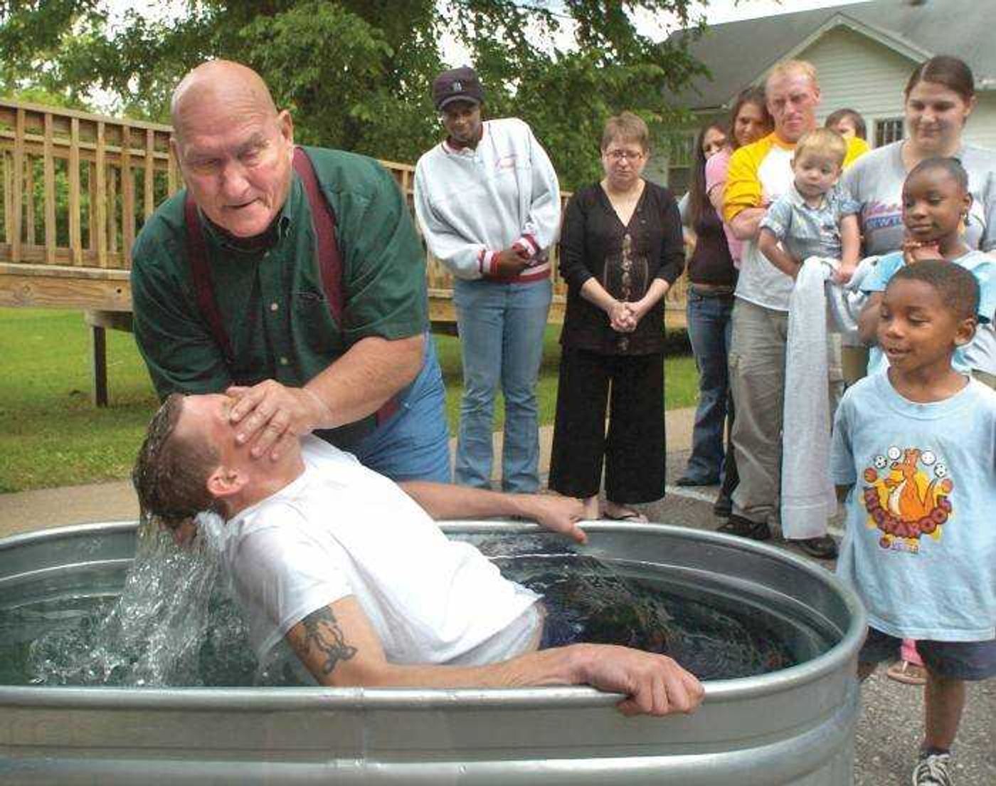 The Rev. Bob Murray baptized Shawn Barker Sunday at Holy Spirit Harvest Church 
in Cape Girardeau.