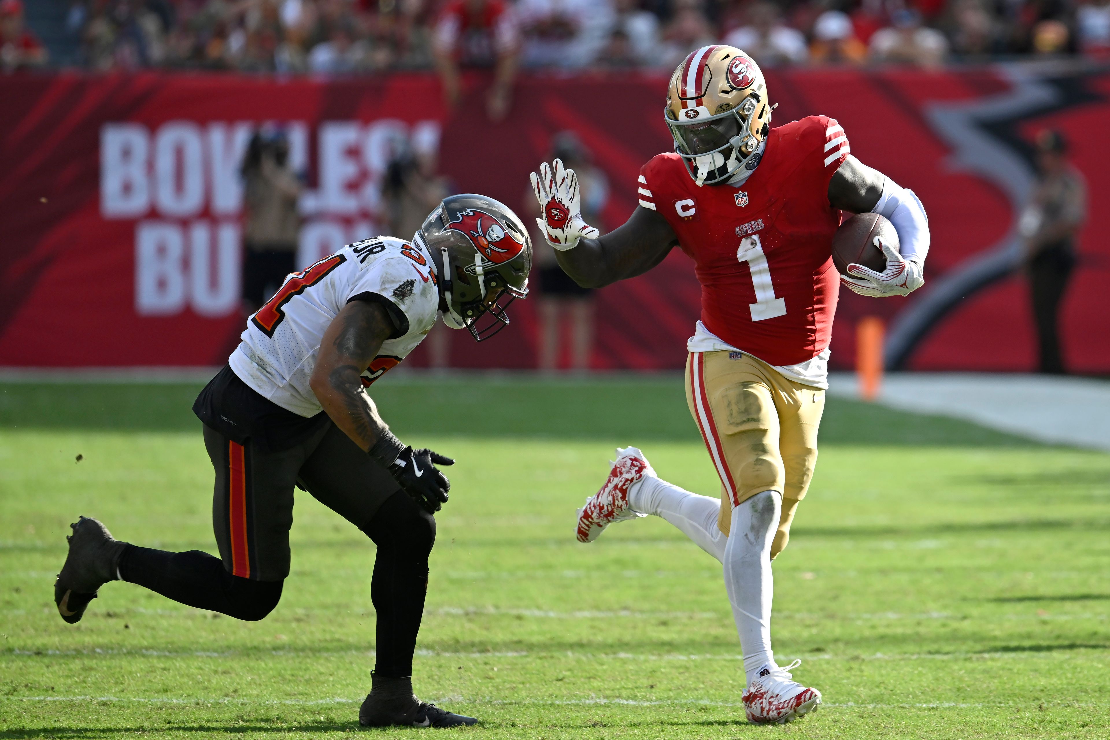 San Francisco 49ers wide receiver Deebo Samuel Sr. (1) runs against Tampa Bay Buccaneers safety Antoine Winfield Jr. during the second half of an NFL football game in Tampa, Fla., Sunday, Nov. 10, 2024. (AP Photo/Jason Behnken)