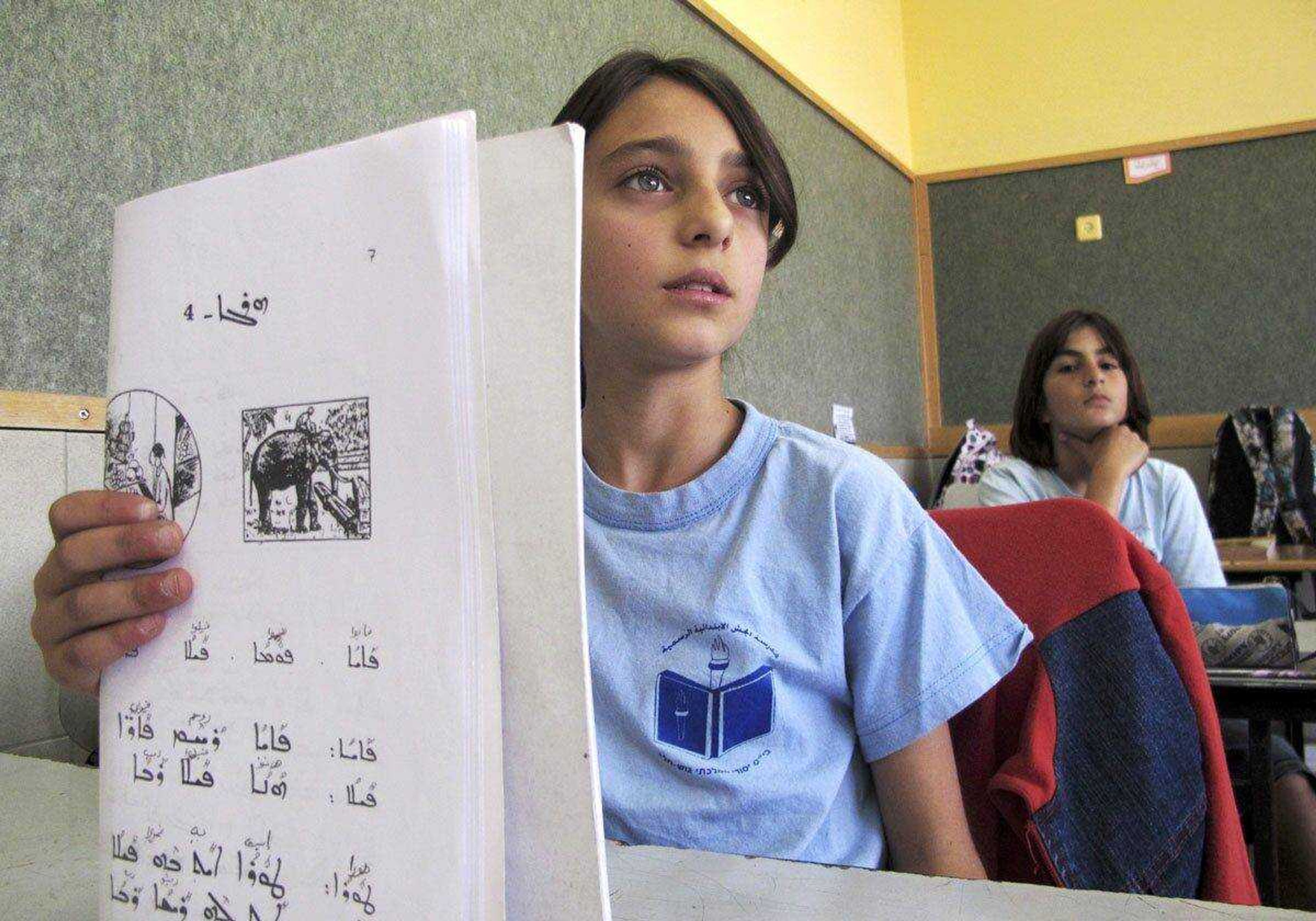 Schoolgirls study Aramaic on May 2 in the Arab village of Jish, northern Israel.<br>Diaa Hadid<br>Associated Press