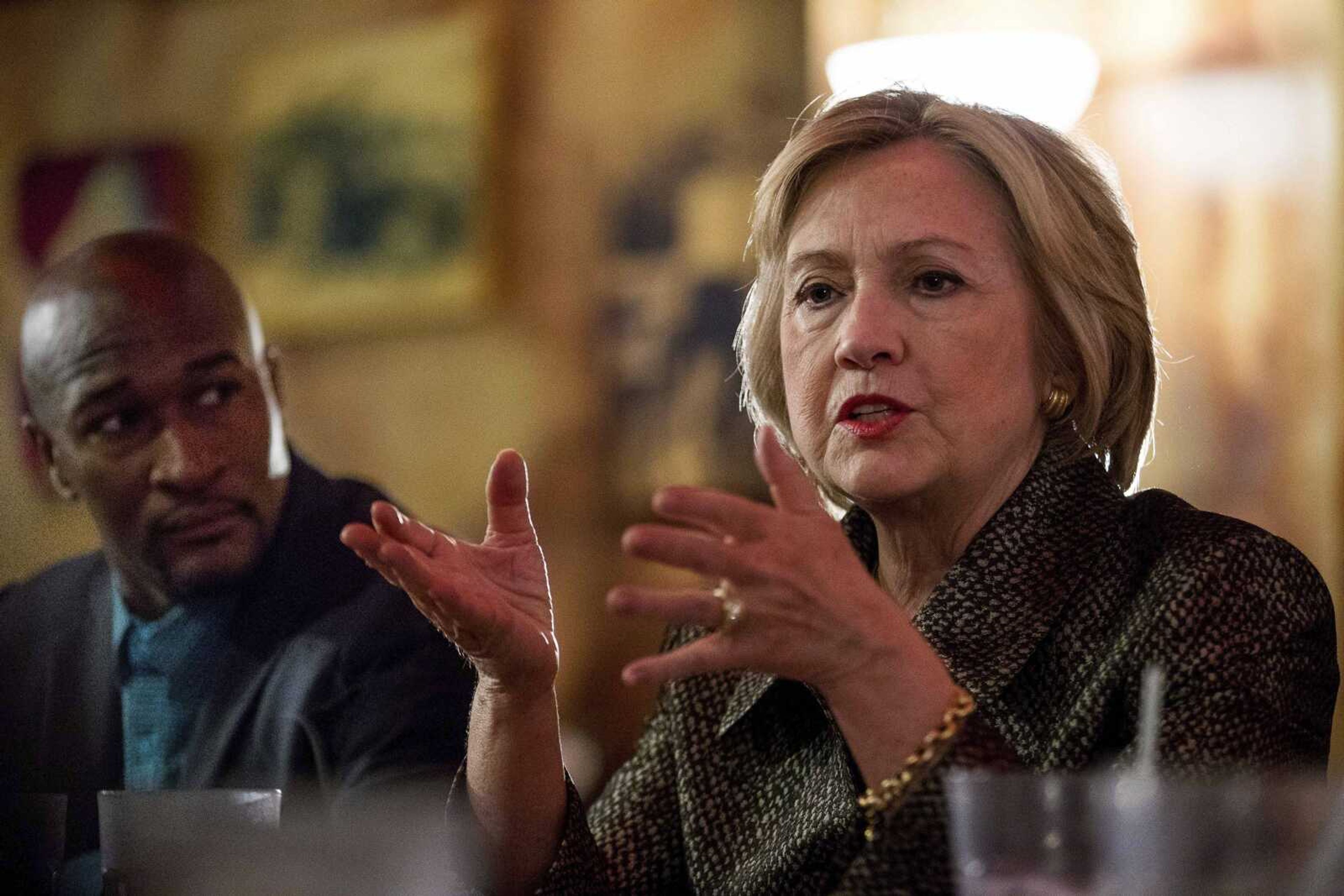 Democratic presidential candidate Hillary Clinton meets with African-American community leaders Sunday at Mert's Heart & Soul in Charlotte, North Carolina, to discuss the urgency of addressing racial, economic and social-justice issues.