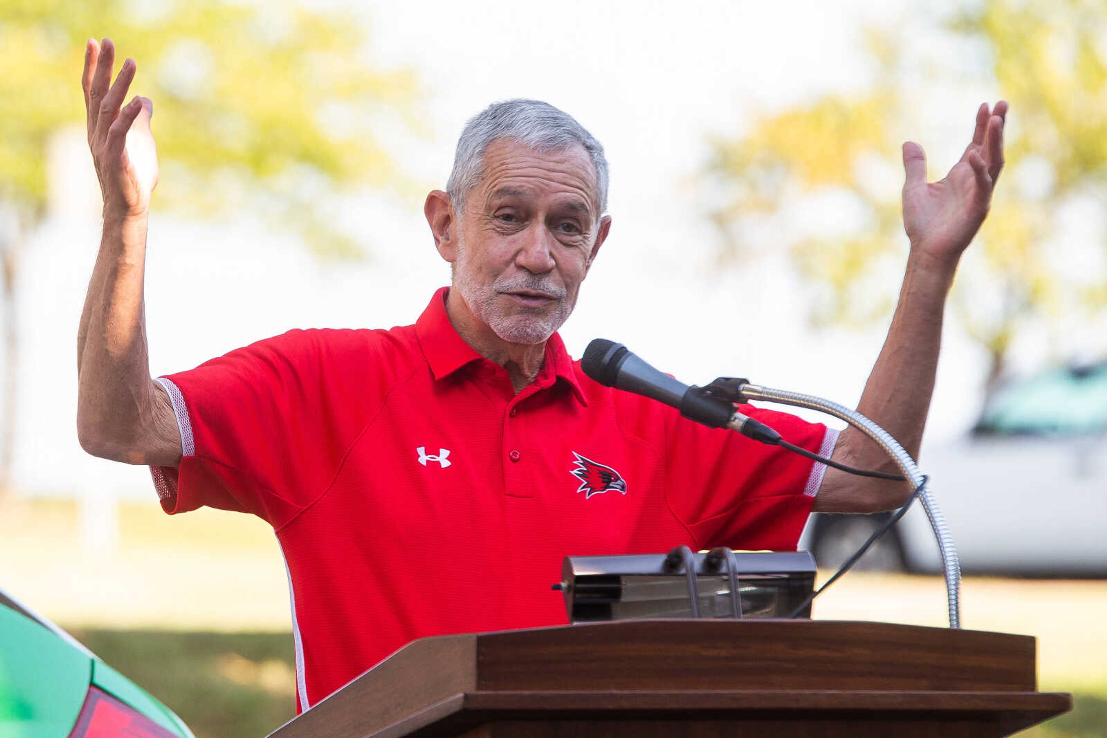 Southeast Missouri State University President Dr. Carlos Vargas gestures up towards the solar panels above as he addresses the crowd on Thursday, Aug. 25.