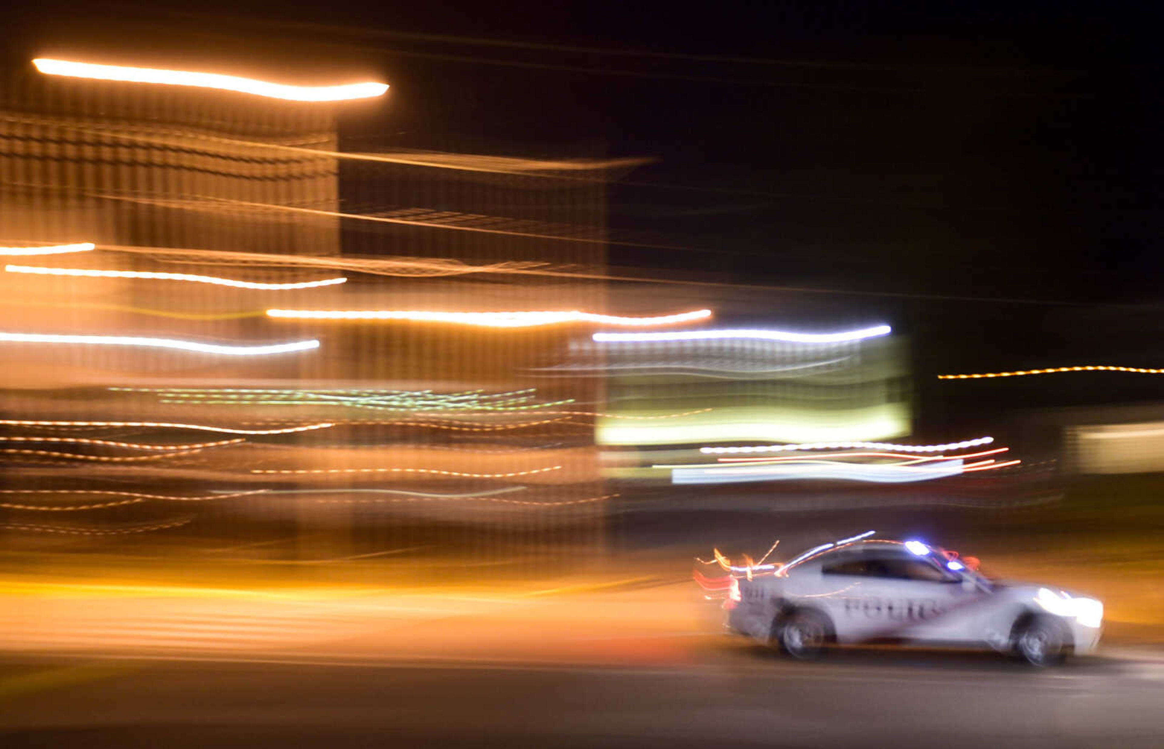 A police officer speeds to answer a call Saturday, July 28, 2018, in Jackson.